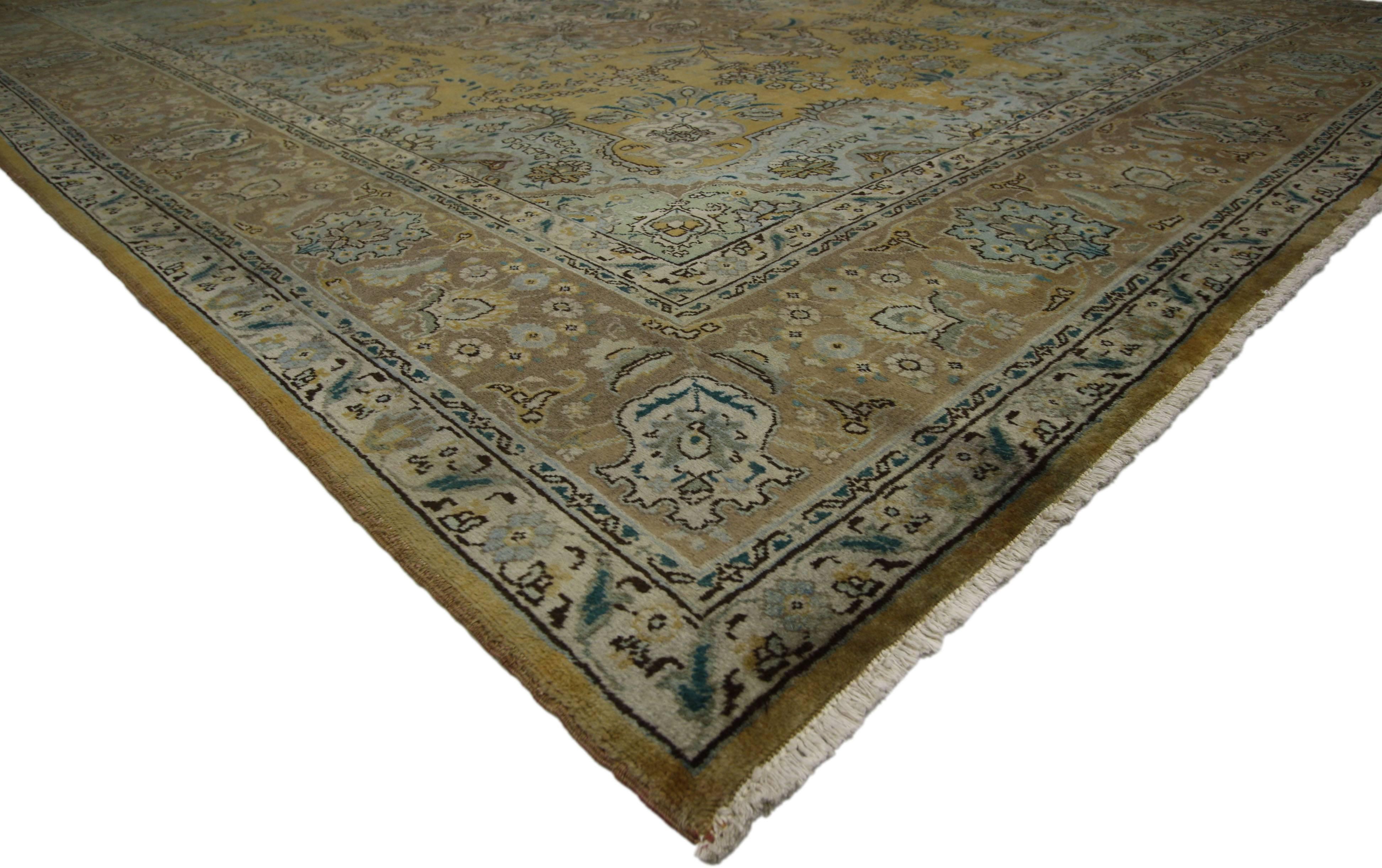 76441, vintage Persian Tabriz rug with traditional style. This hand-knotted wool vintage Persian Tabriz rug features a centre medallion and an allover pattern surrounded by a classic border creating a well-balanced and timeless design. This vintage