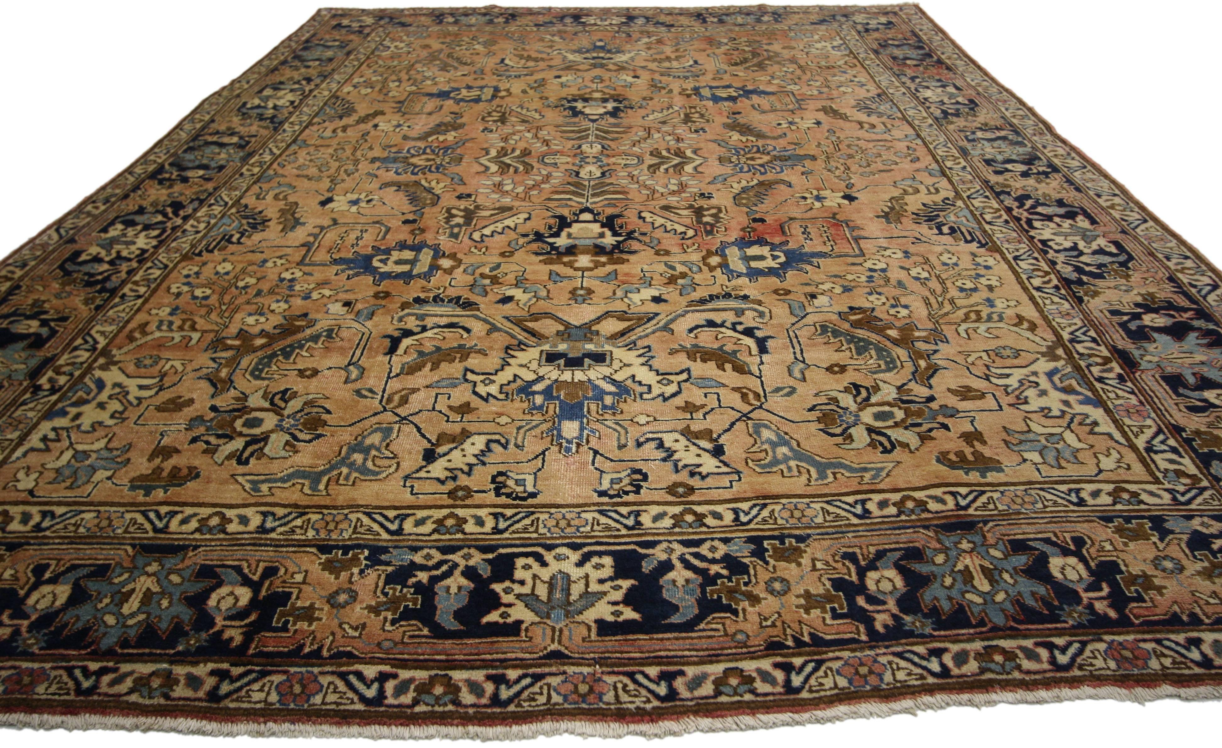 75337 vintage Persian Tabriz rug with traditional style. This hand-knotted wool vintage Persian Tabriz rug features an allover pattern surrounded by a classic border creating a well-balanced and timeless design. This vintage Persian Tabriz rug