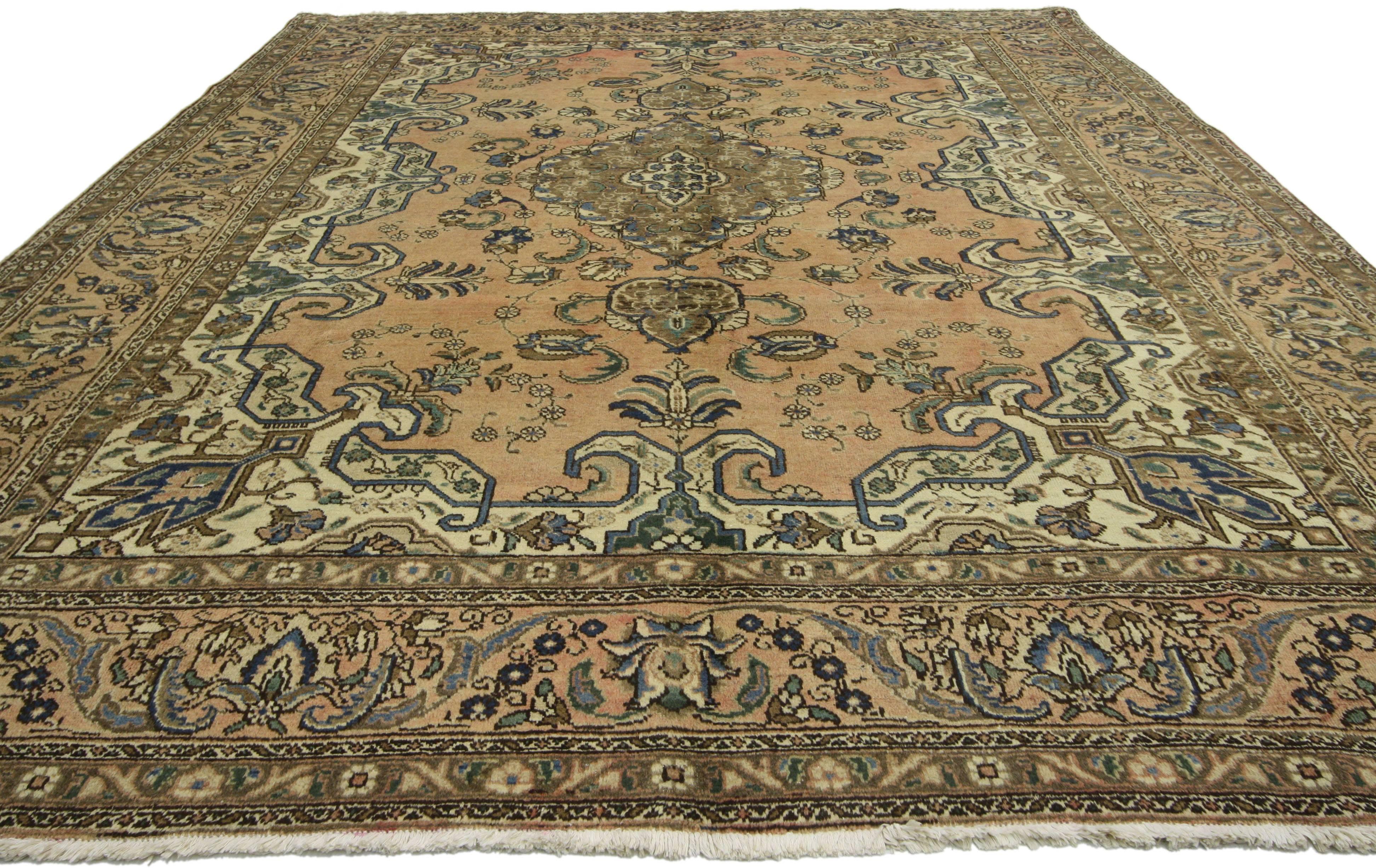 76435, vintage Persian Tabriz rug with traditional style. This hand-knotted wool vintage Persian Tabriz rug features a centre medallion with an all-over floral pattern surrounded by a Classic border creating a well-balanced and timeless design. This