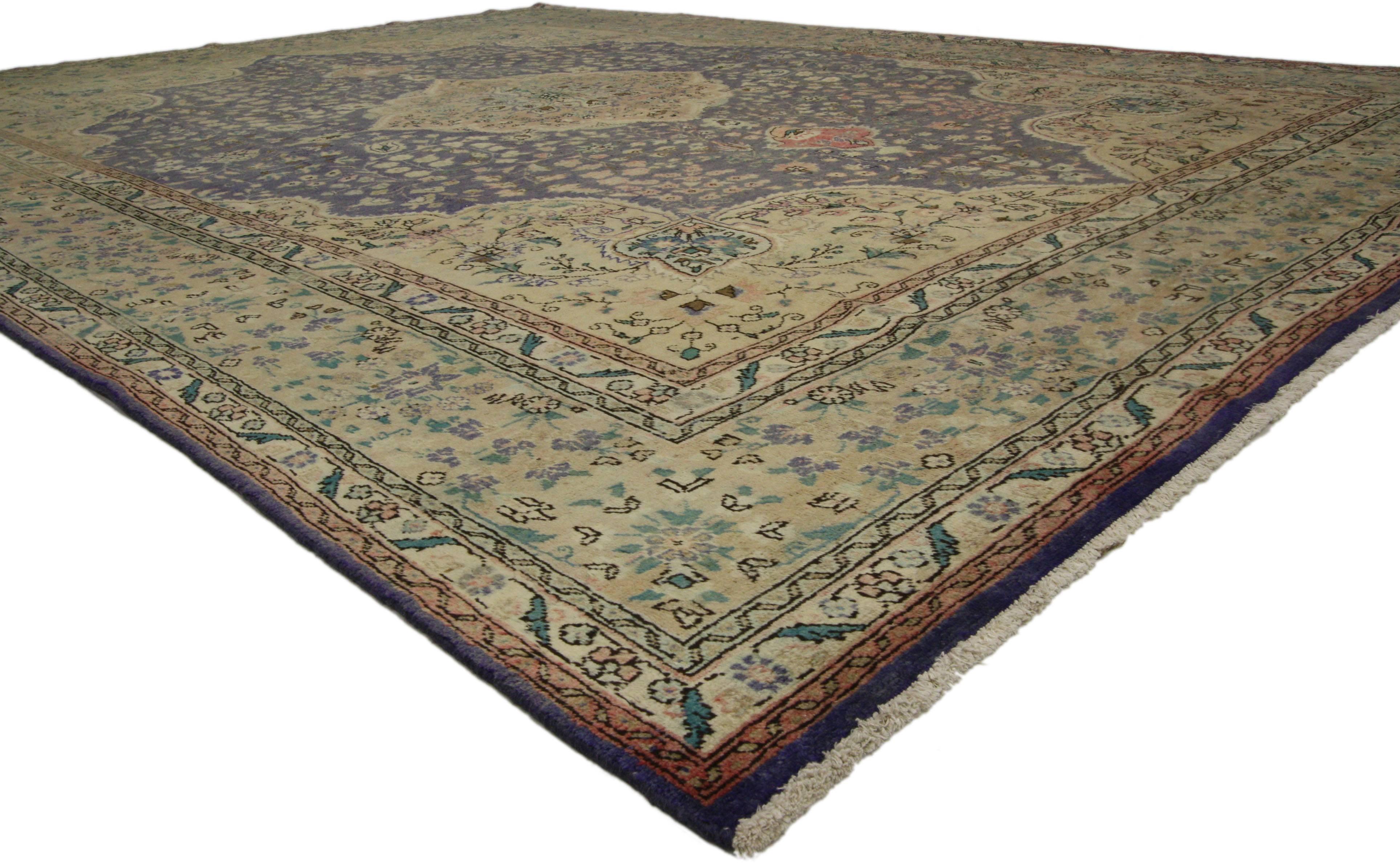 76417 Vintage Persian Tabriz Rug with European Cottage Style  09'10 X 13'00. With its rich detailing and densely ornamented florals, this hand-knotted wool vintage Persian Tabriz rug beautifully embodies European Cottage style. It features a cusped