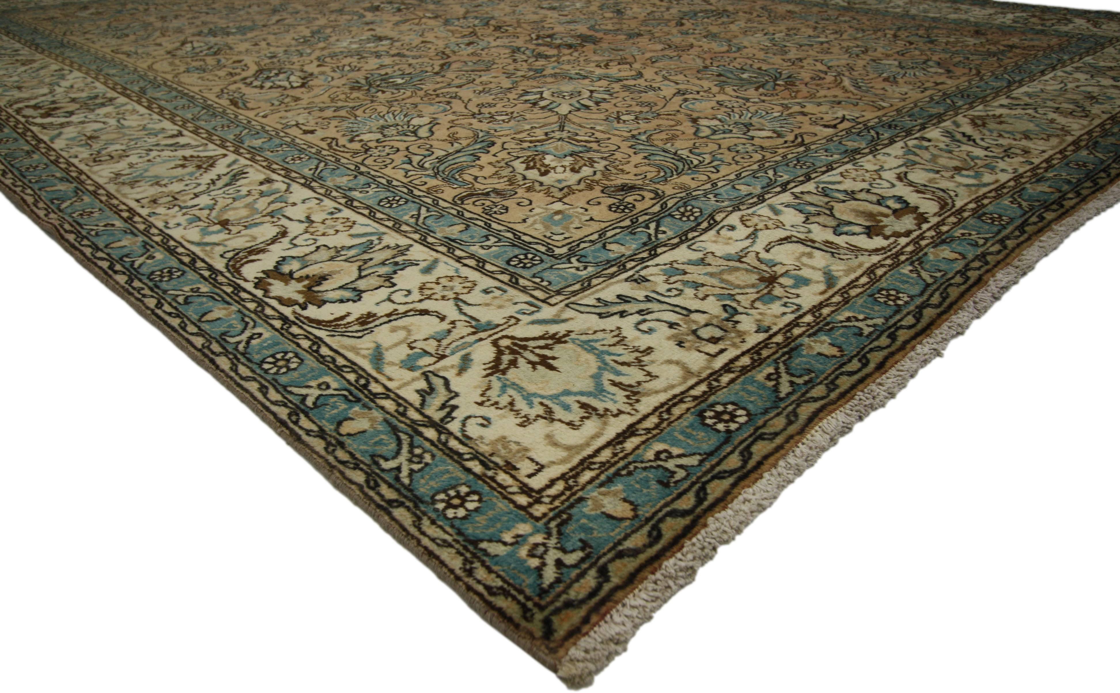 76289 Vintage Persian Tabriz Rug with Rustic Georgian Style 09'05 X 12'04. With a traditional feel and Classic floral pattern, this hand-knotted wool vintage Persian Tabriz rug beautifully embodies a rustic Georgian style. It features an all-over