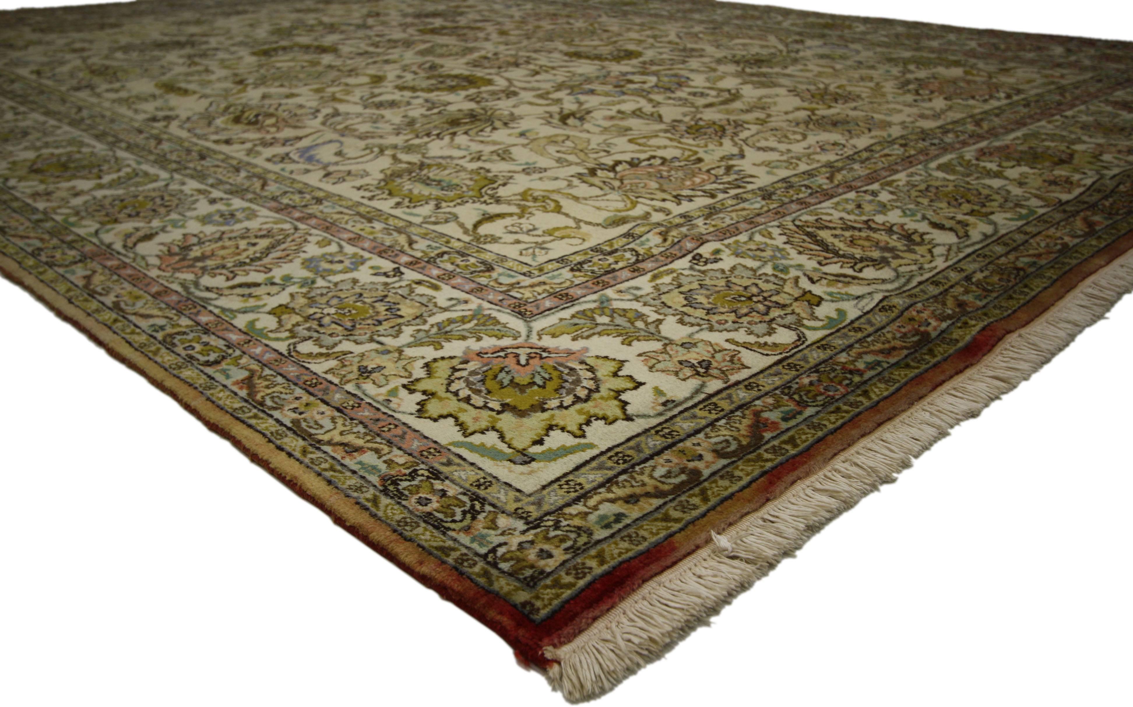 71929 Vintage Persian Tabriz Area Rug with French Provincial Cottage Style. Timeless and refined, this hand-knotted wool vintage Persian Tabriz rug features an all-over floral patter composed of blooming palmettes, leafy tendrils, rosettes, and