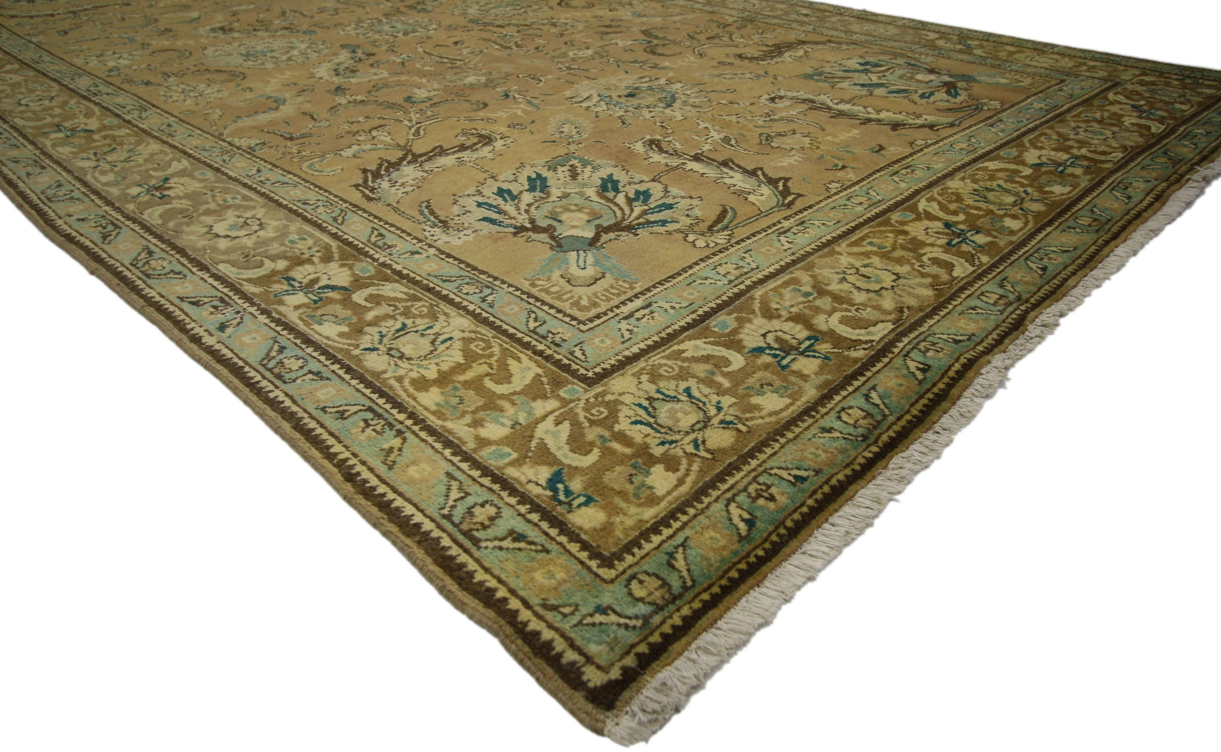76335, vintage Persian Tabriz rug with traditional style. This hand-knotted wool vintage Persian Tabriz rug features an all-over pattern surrounded by a Classic border creating a well-balanced and timeless design. This vintage Persian Tabriz rug