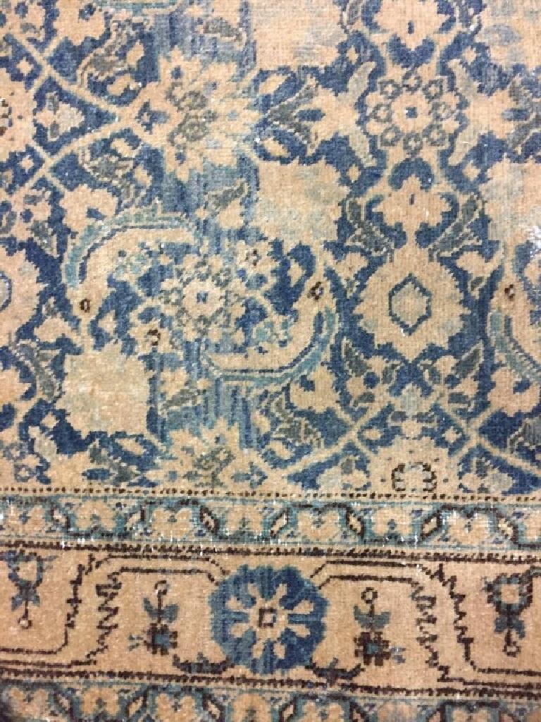 Vintage Persian Tabriz runner, circa 1940. Measures: 3' x 16'8. The blue field filled with floral elements in soft colors complimented by a main border in a reverse colorway.