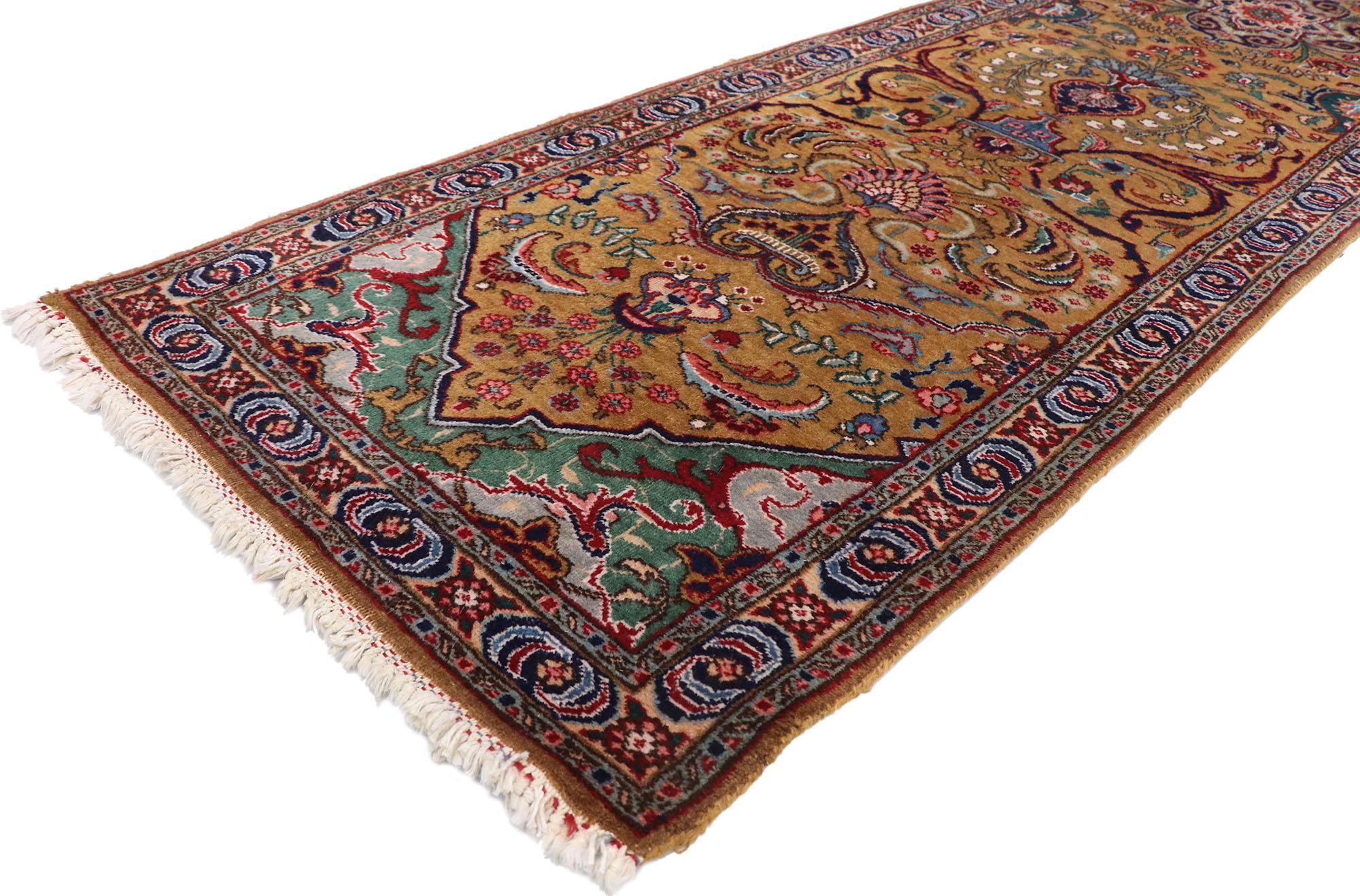77661 Vintage Persian Tabriz runner, 02'10 x 14'00? Displaying an impressive array of floral elements with incredible detail and texture, this hand knotted vintage Persian Tabriz runner is a captivating vision of woven beauty. The timeless design