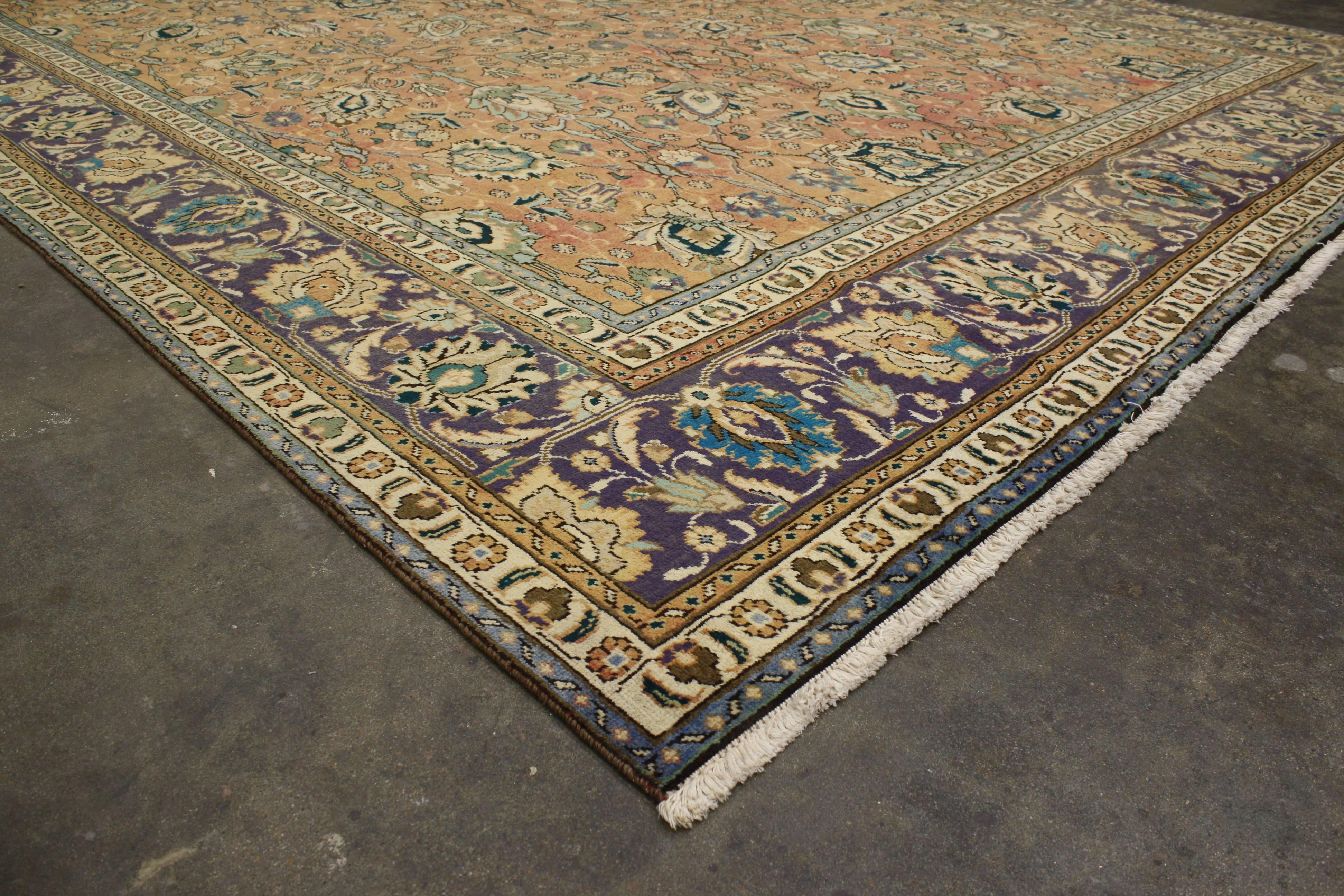 76303, vintage Persian Tabriz with traditional style. This hand-knotted wool vintage Persian Tabriz rug features an allover pattern surrounded by a classic border creating a well-balanced and timeless design. This vintage Persian Tabriz rug brings a