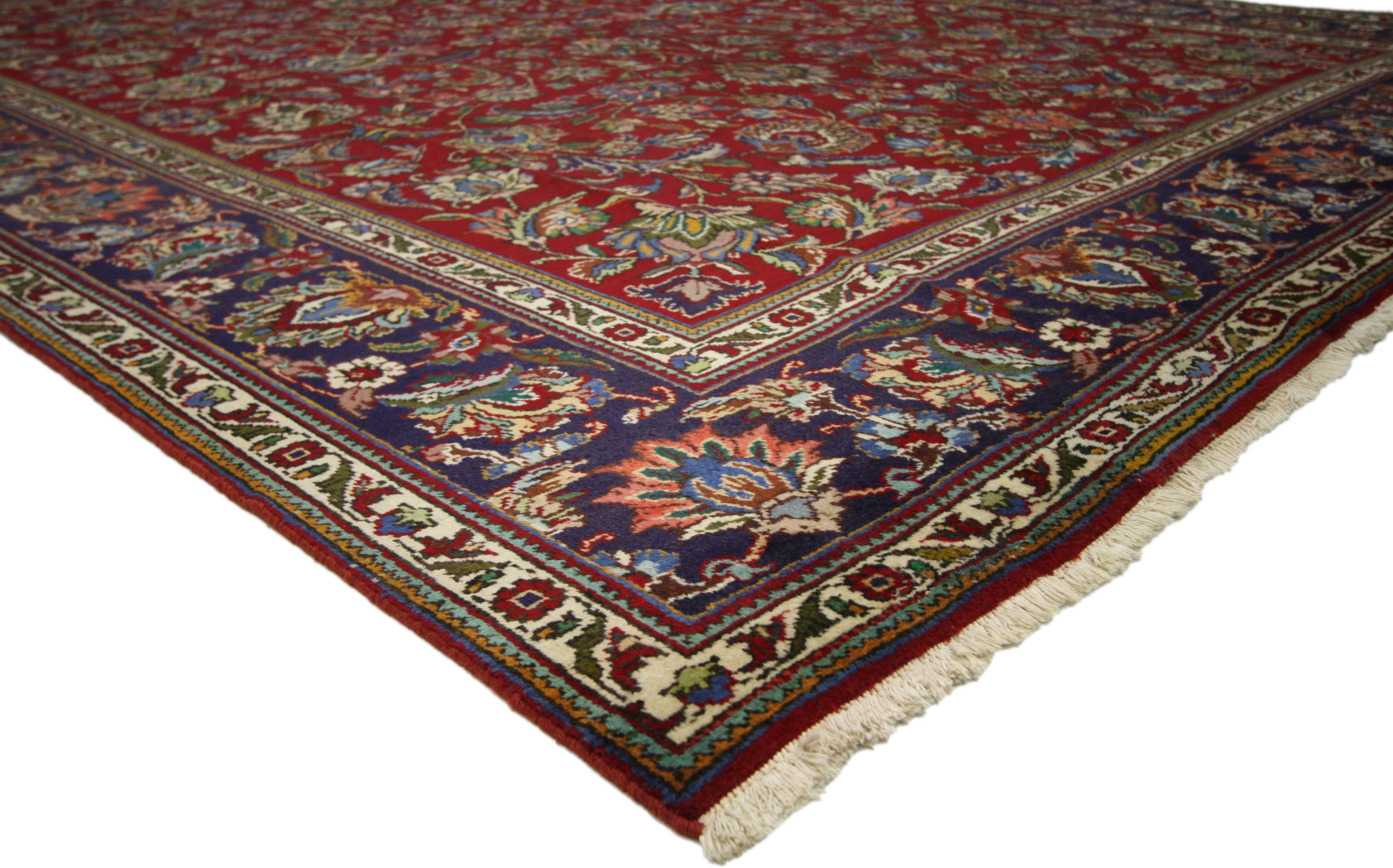 76262 Vintage Persian Tabriz Area Rug with Traditional Colonial and Federal Style. This hand-knotted wool vintage Persian Tabriz rug features an allover pattern surrounded by a classic border creating a well-balanced and timeless design. This