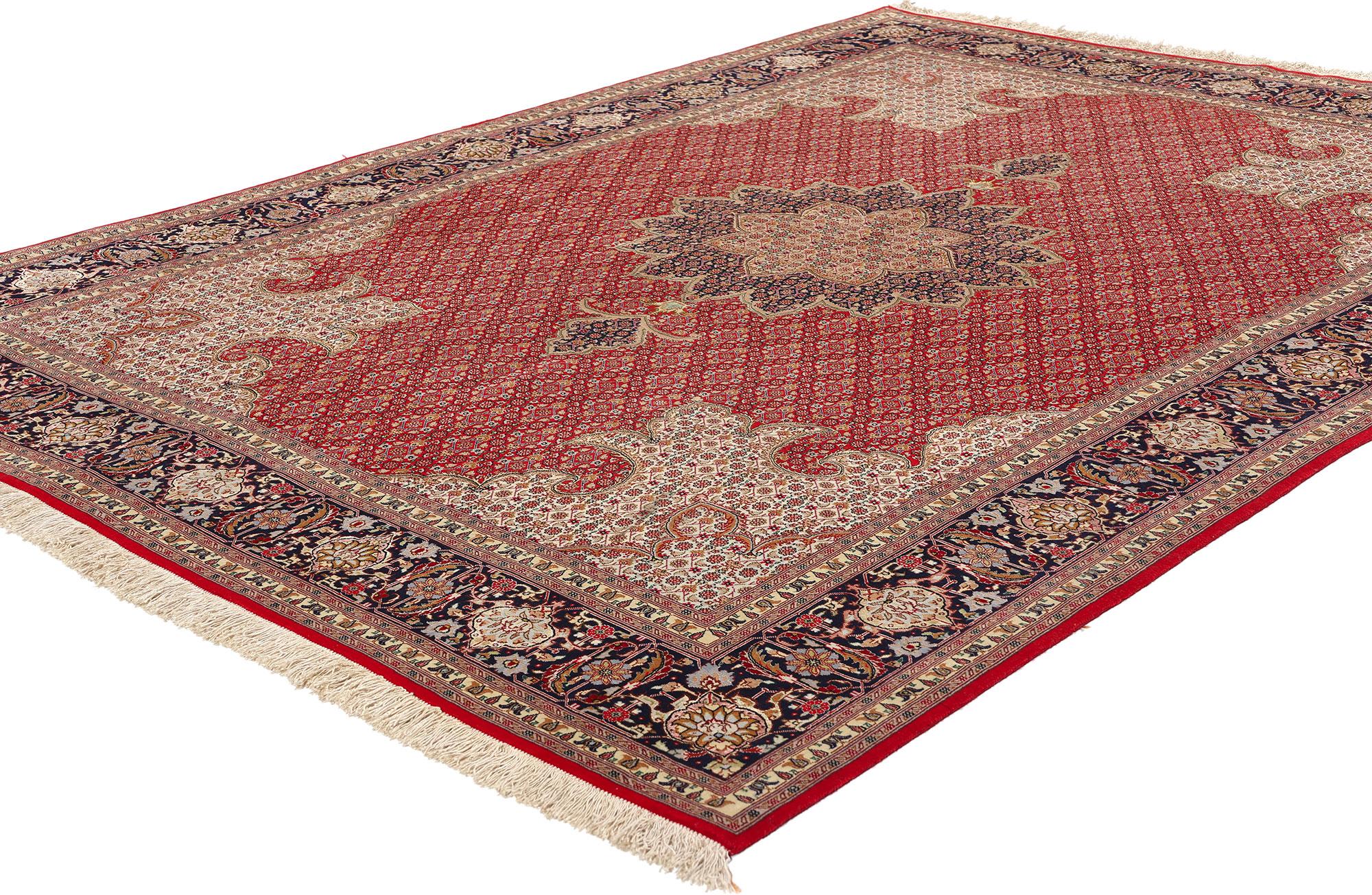 77001 Vintage Persian Mahi Tabriz Rug, 04'11 x 06'10. Situated among the Sahand Evnali mountains in Azerbaijan, Iran, the Quru Valley reveals the enchanting city of Tabriz, renowned for its exceptional handcrafted carpets. Tabriz holds a