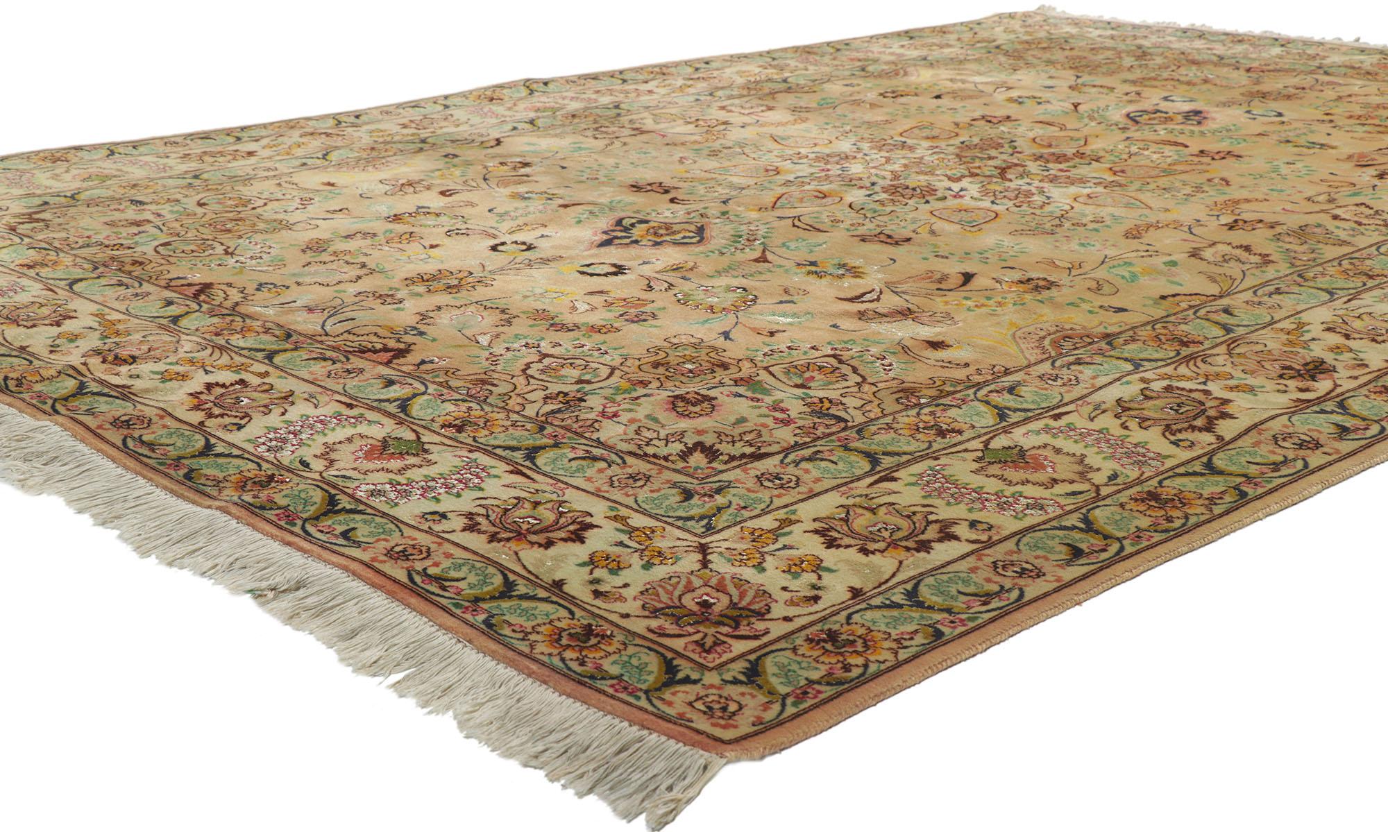 78171 vintage Persian Tabriz wool and silk rug, 06'08 x 09'10. Rendered in variegated shades of ochre, ecru, sandstone, cider, green, rust, beige, sage, light green, rose, gold, navy blue, rosewood, olive, brown, and maroon with other accent colors.