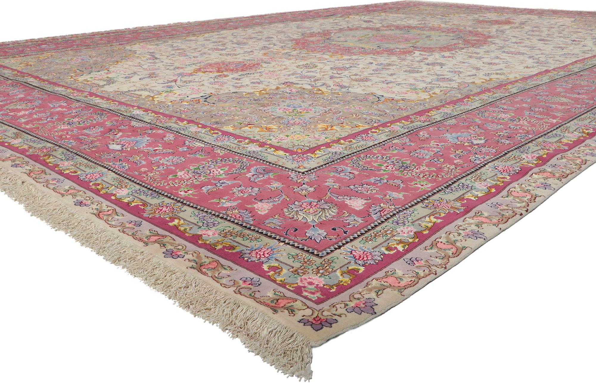 78326 vintage Persian Tabriz rug, 12'09 x 19'09.
Displaying an impressive array of floral elements with incredible detail and texture, this hand knotted wool and silk vintage Persian Tabriz rug is a captivating vision of woven beauty. The timeless