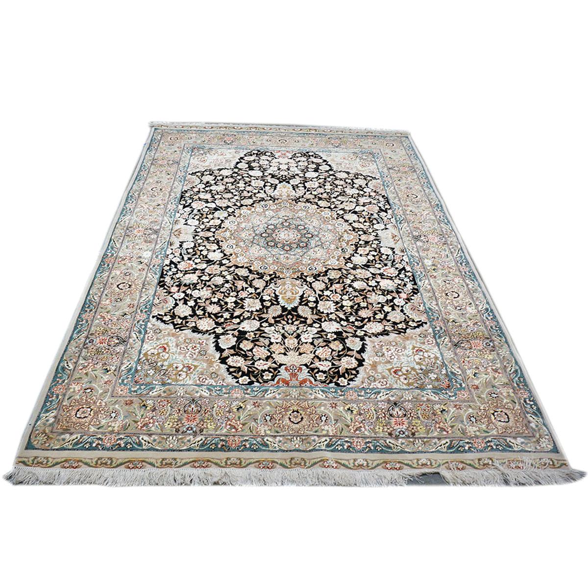 Ashly Fine Rugs presents a 1960s Vintage Persian Tabriz wool & silk 5x8 blue, black, & ivory handmade area rug. Tabriz is a northern city in modern-day Iran and has forever been famous for the fineness and craftsmanship of its handmade rugs. This