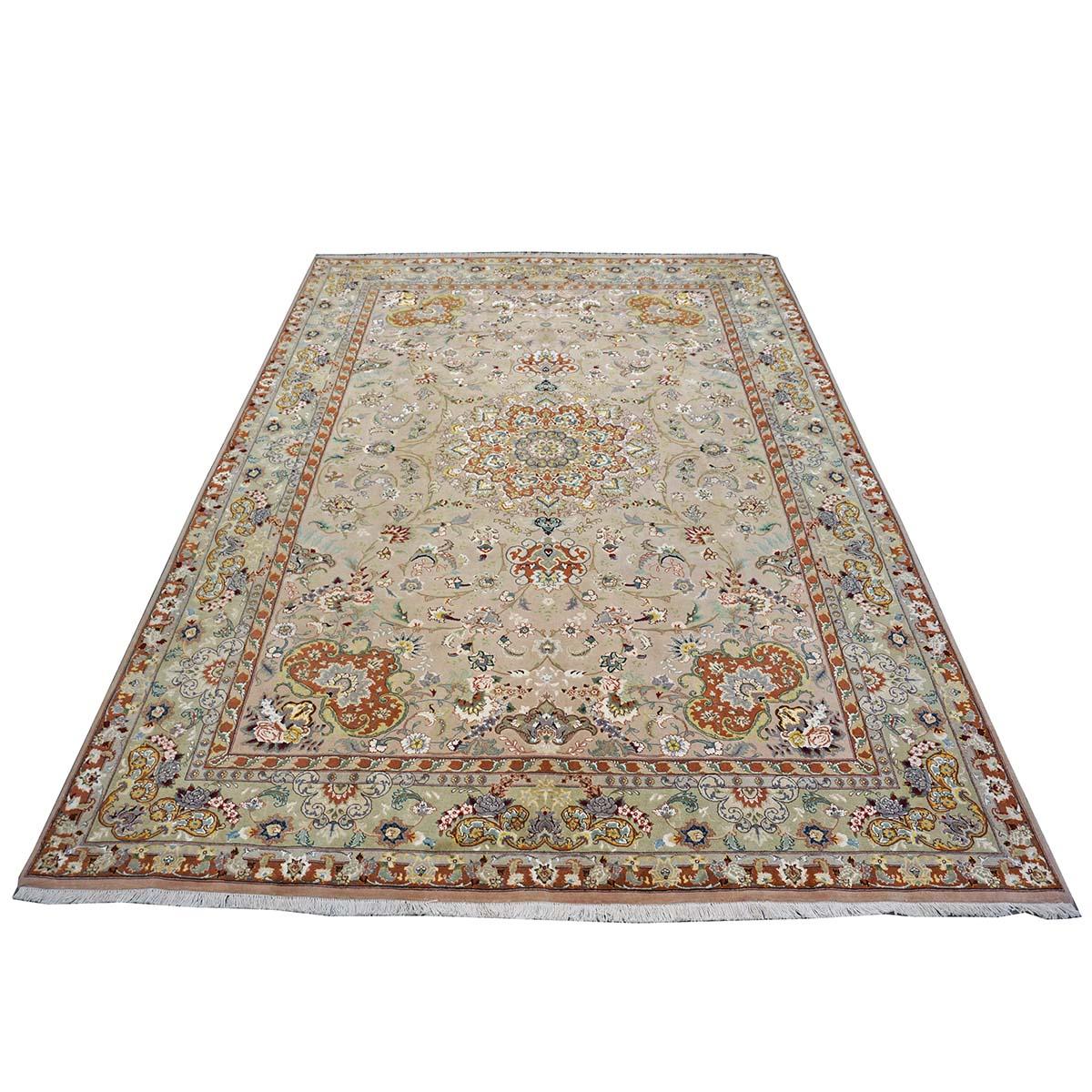Ashly fine Rugs presents a 2000s Vintage Persian Tabriz Wool & Silk. Tabriz is a northern city in modern-day Iran and has forever been famous for the fineness and craftsmanship of its handmade rugs. This piece has a wonderful light mauve background