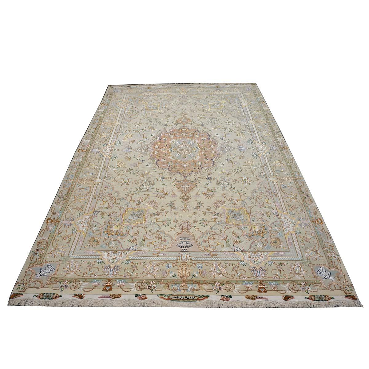 Ashly Fine Rugs presents a 2000s Vintage Persian Tabriz Wool & Silk. Tabriz is a northern city in modern-day Iran and has forever been famous for the fineness and craftsmanship of its handmade rugs. This piece has an amazing ivory background with