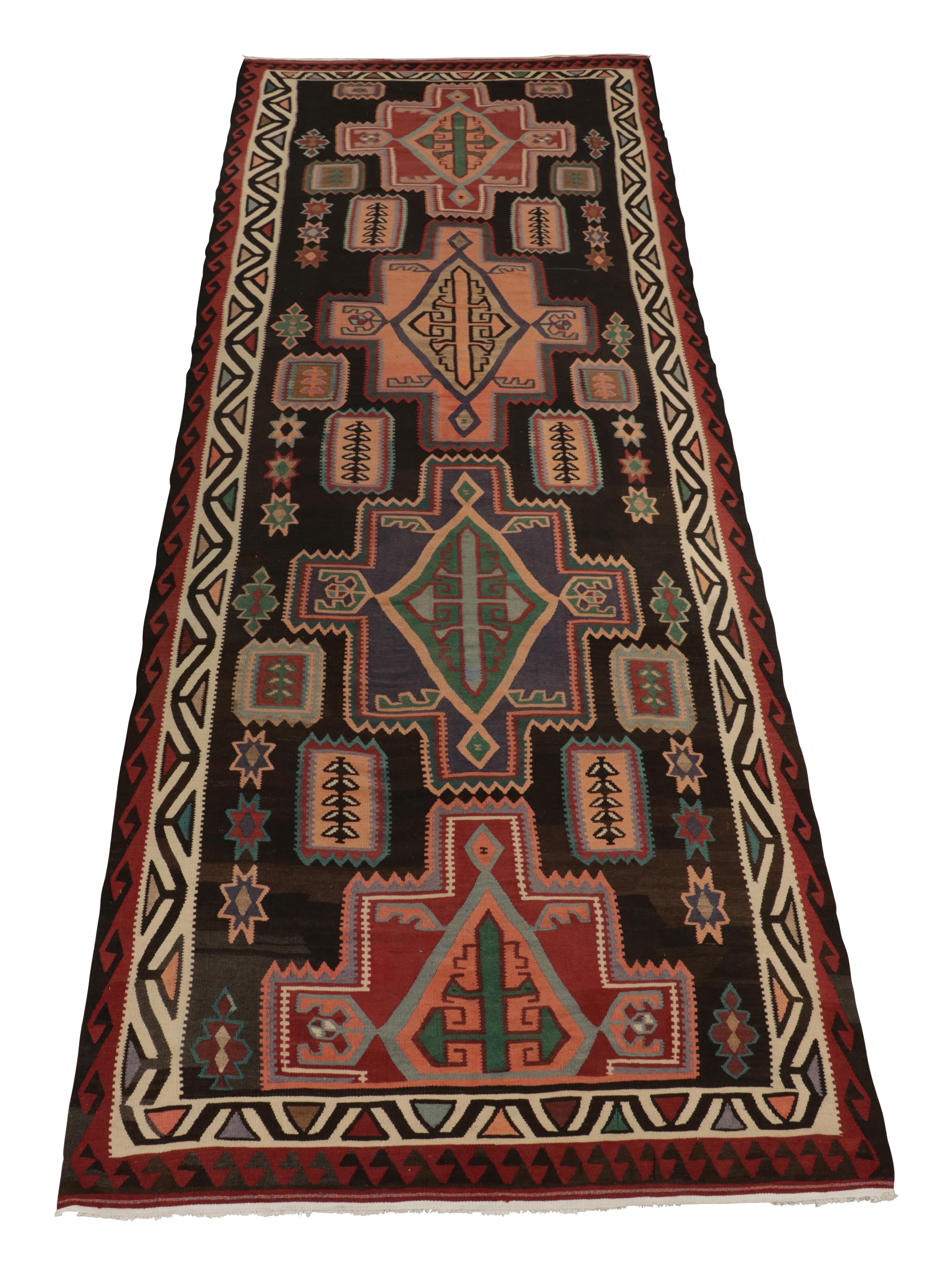 This vintage 7x19 Persian kilim is a rare tribal rug for its size and style alike. Handwoven in wool, it originates circa 1950-1960.

Further on the Design:

The design prefers a vibrant range of colors in its medallion and geometric patterns on