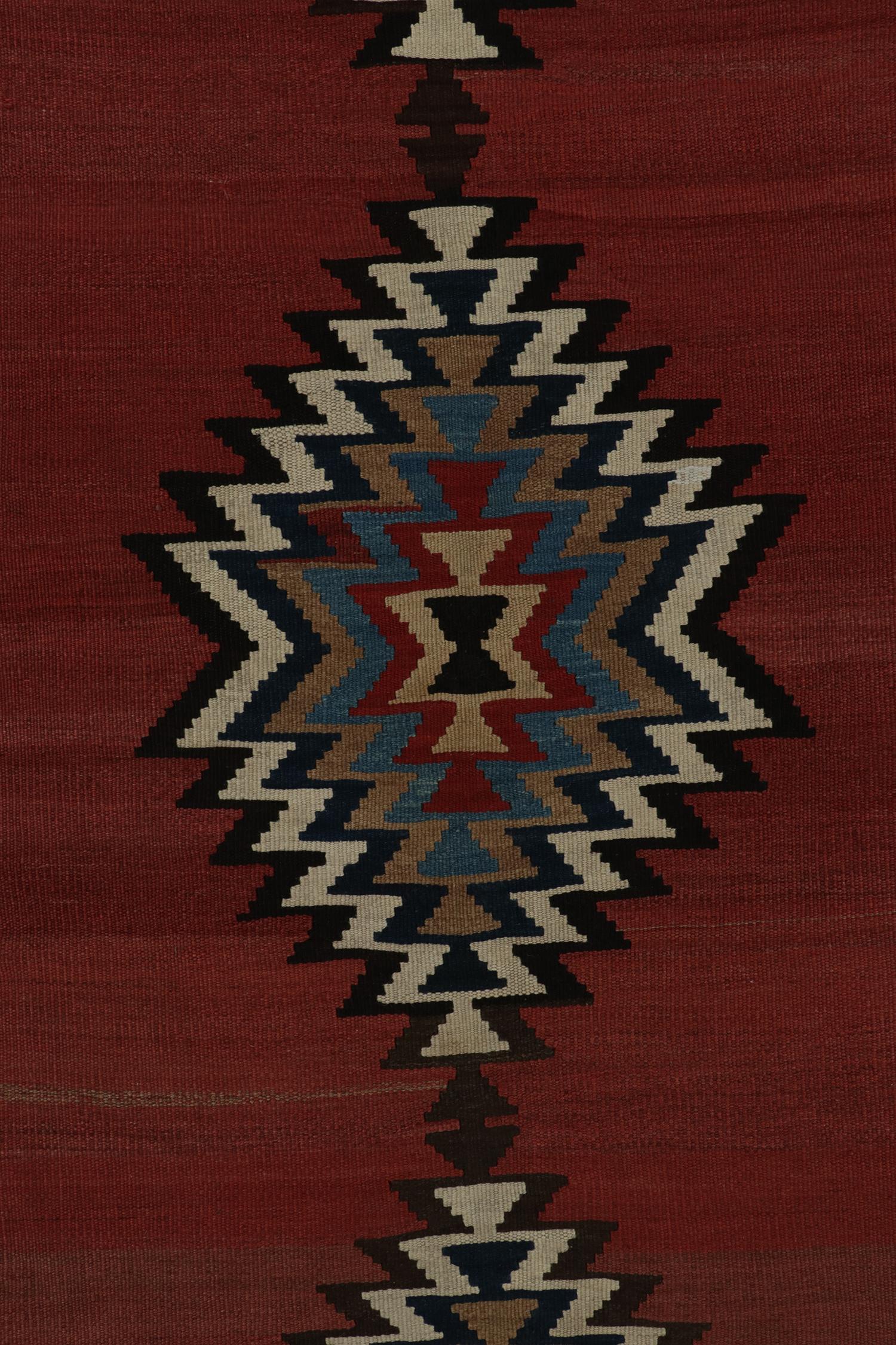 Wool Vintage Persian Tribal Kilim rug in Polychromatic Patterns by Rug & Kilim For Sale