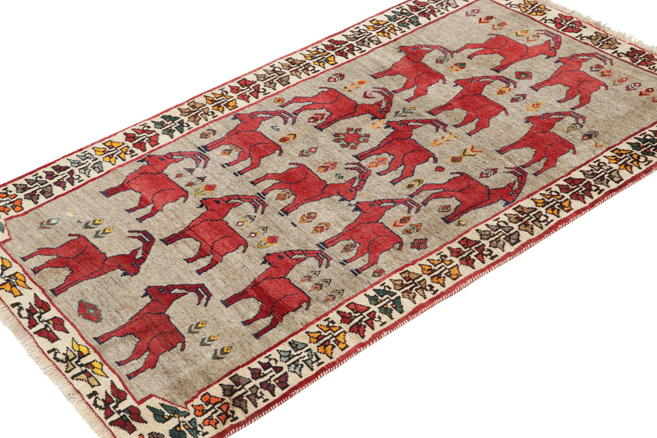 Hand-Knotted Vintage Persian Tribal Rug in Beige with Red Animal Pictorials by Rug & Kilim For Sale