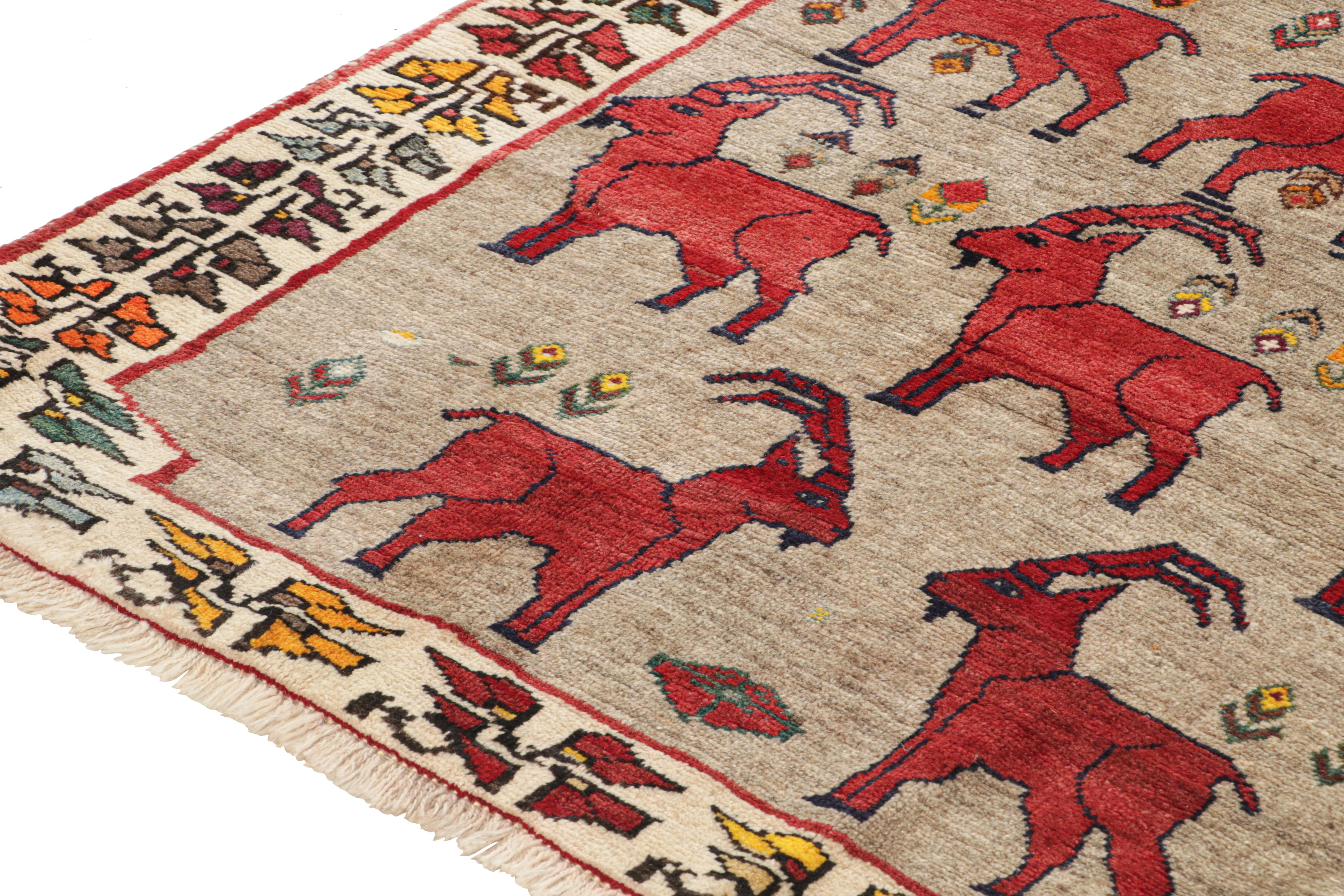 Mid-20th Century Vintage Persian Tribal Rug in Beige with Red Animal Pictorials by Rug & Kilim For Sale