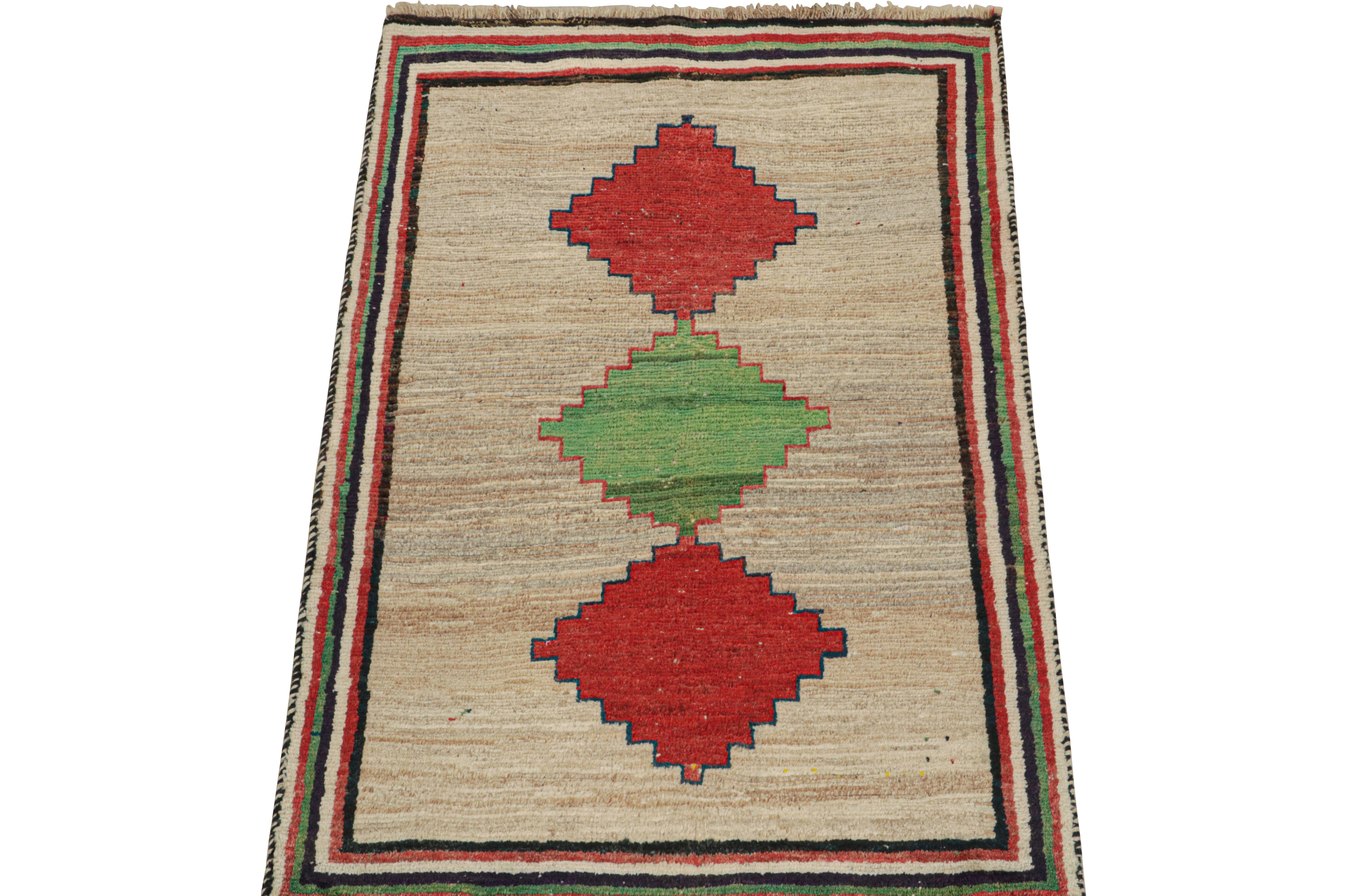 This vintage 3x6 Persian runner is a mid-century tribal piece, hand-knotted in wool circa 1950-1960.

Its design is a classic play of medallions over an open field—one of R&K Principal Josh Nazmiyal’s favorite styles. The medallions and borders