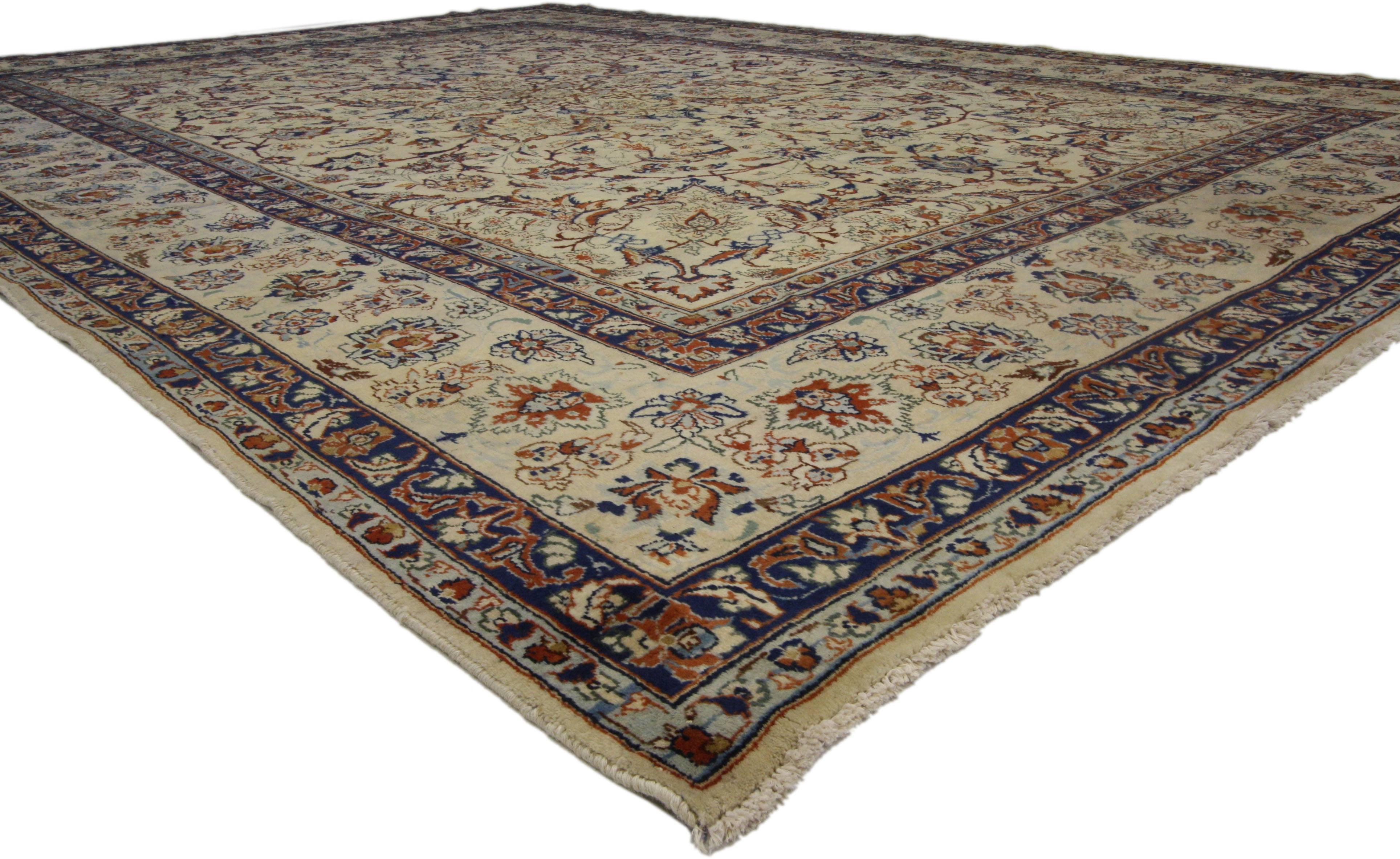 76490, vintage Persian Yazd area rug with traditional style. An excellent representation of Persian culture, this captivating antique rug features an inconspicuous central medallion composed of elaborate flowers and arabesque vines dancing with