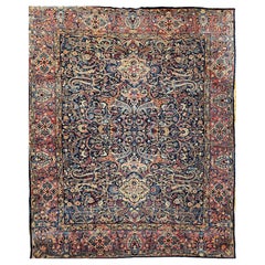 Alfombra persa vintage Yazd con motivos florales en azul marino, azul y rojo