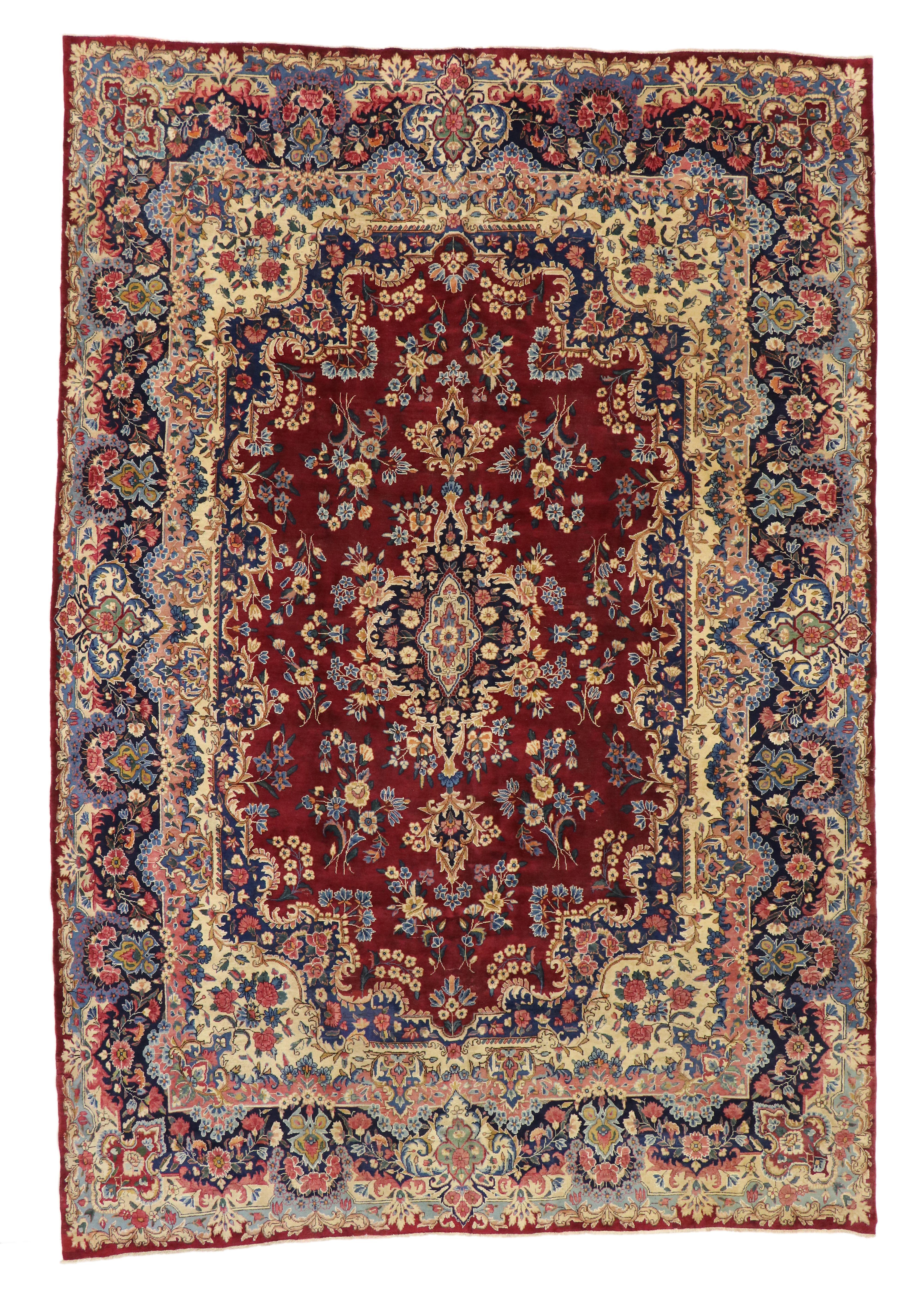 73735 Vintage Persian Yazd Rug with Traditional English and Old World Style 09'08 x 14'01. With an impressive array of realistic floral elements and brilliant, alluring color, this hand knotted wool vintage Persian Yazd rug is poised to impress. At
