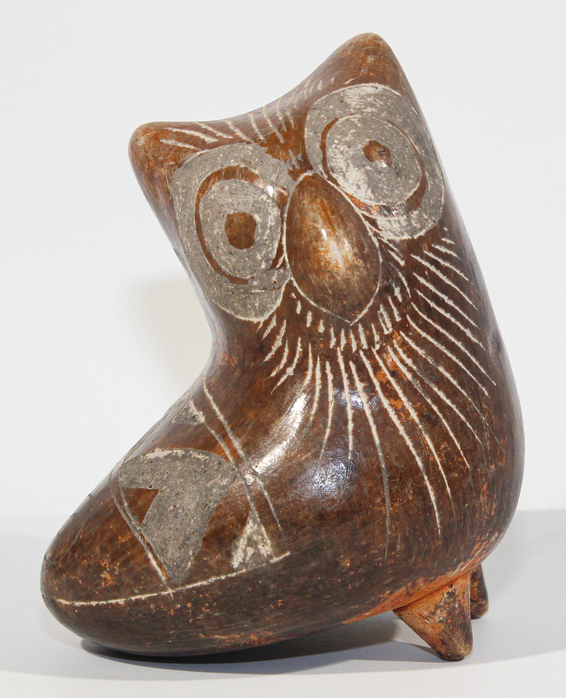 Vintage Peruvian pottery hand crafted owl sculpture.
Beautiful vintage Peru Michu style hand made and hand carved Art Pottery.
Decorative Collectible Peruvian Folk Art stoneware bird.
South American bird ceramic sculpture hand crafted with warm