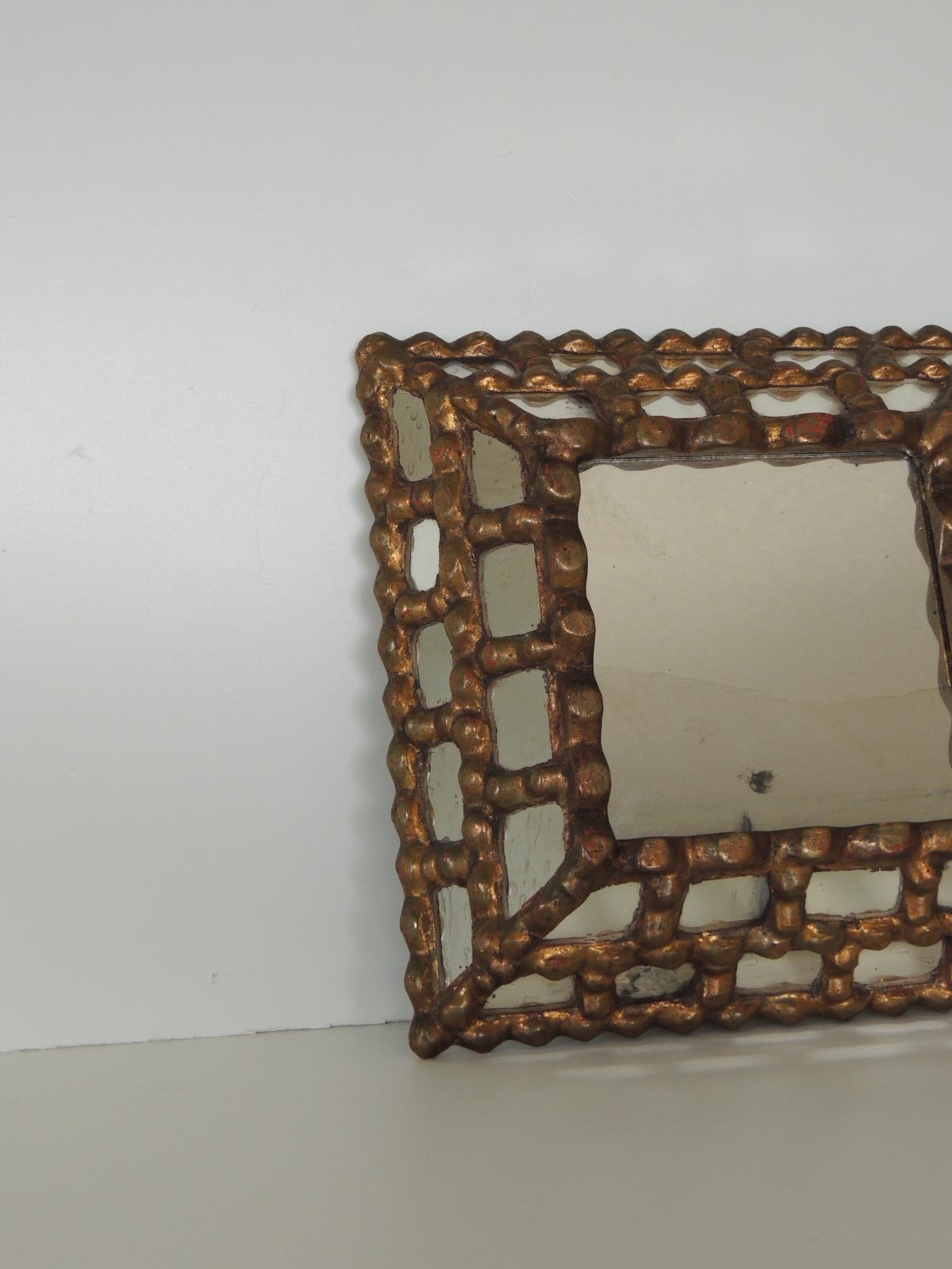 Vintage Peruvian square gold mirror
Mirror tile style frame over wood.
Size: 11
