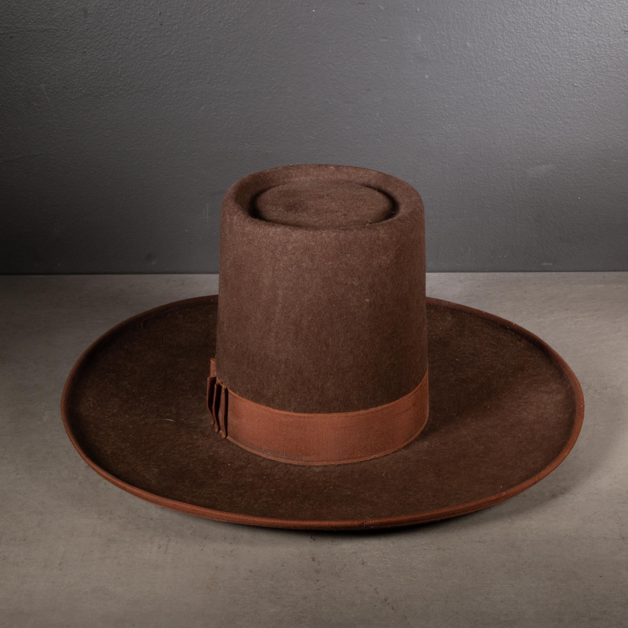 ABOUT

An original tall, wide brimmed wool Peruvian hat trimmed in fabric. Inside rimmed with oil cloth tablecloth. 

    CREATOR Unknown. Peru.
    DATE OF MANUFACTURE c. late 20th century. 
    MATERIALS AND TECHNIQUES Wool, Fabric. 
    CONDITION