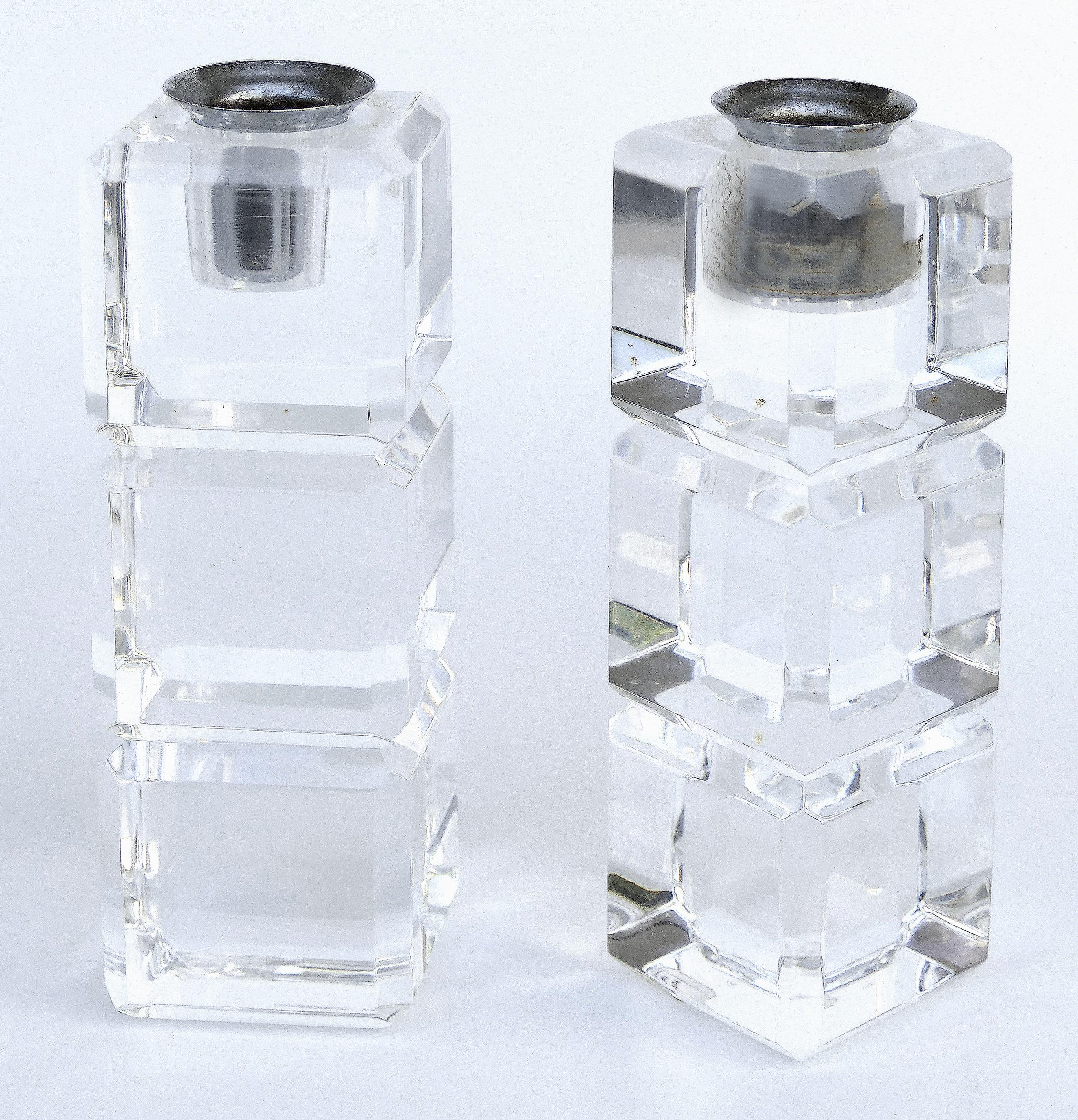 Vintage Peter Alan designs Lucite candle holders, a pair

Offered for sale is a vintage pair of carved and faceted Lucite candle holders manufactured by Peter Alan designs.