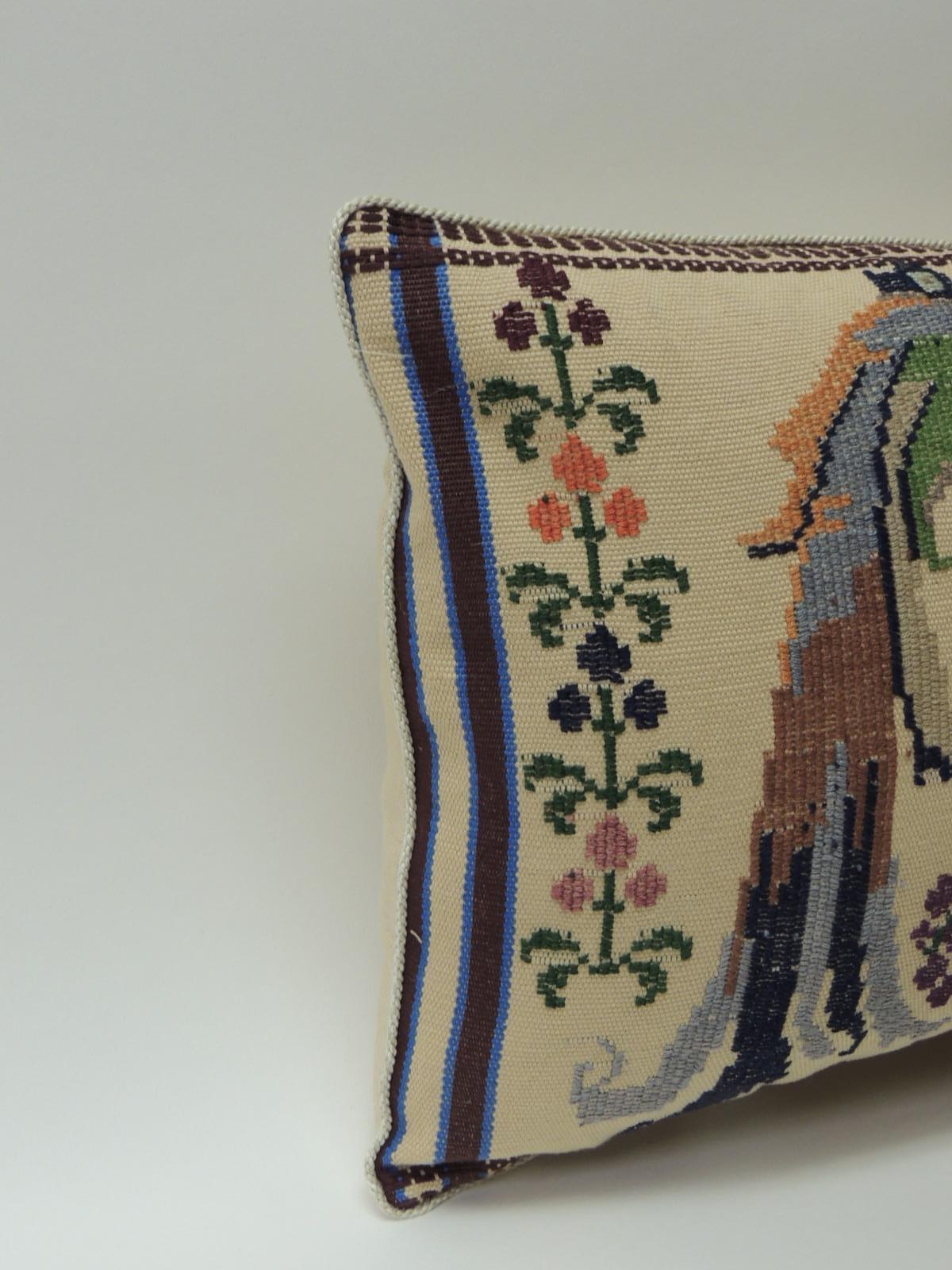 Vintage petite green and red woven Turkish lumbar decorative pillow
Vintage petite green and red woven Turkish lumbar decorative pillow depicting birds of paradise and framed with flowers and vines. Throw pillow embellished with a small natural rope