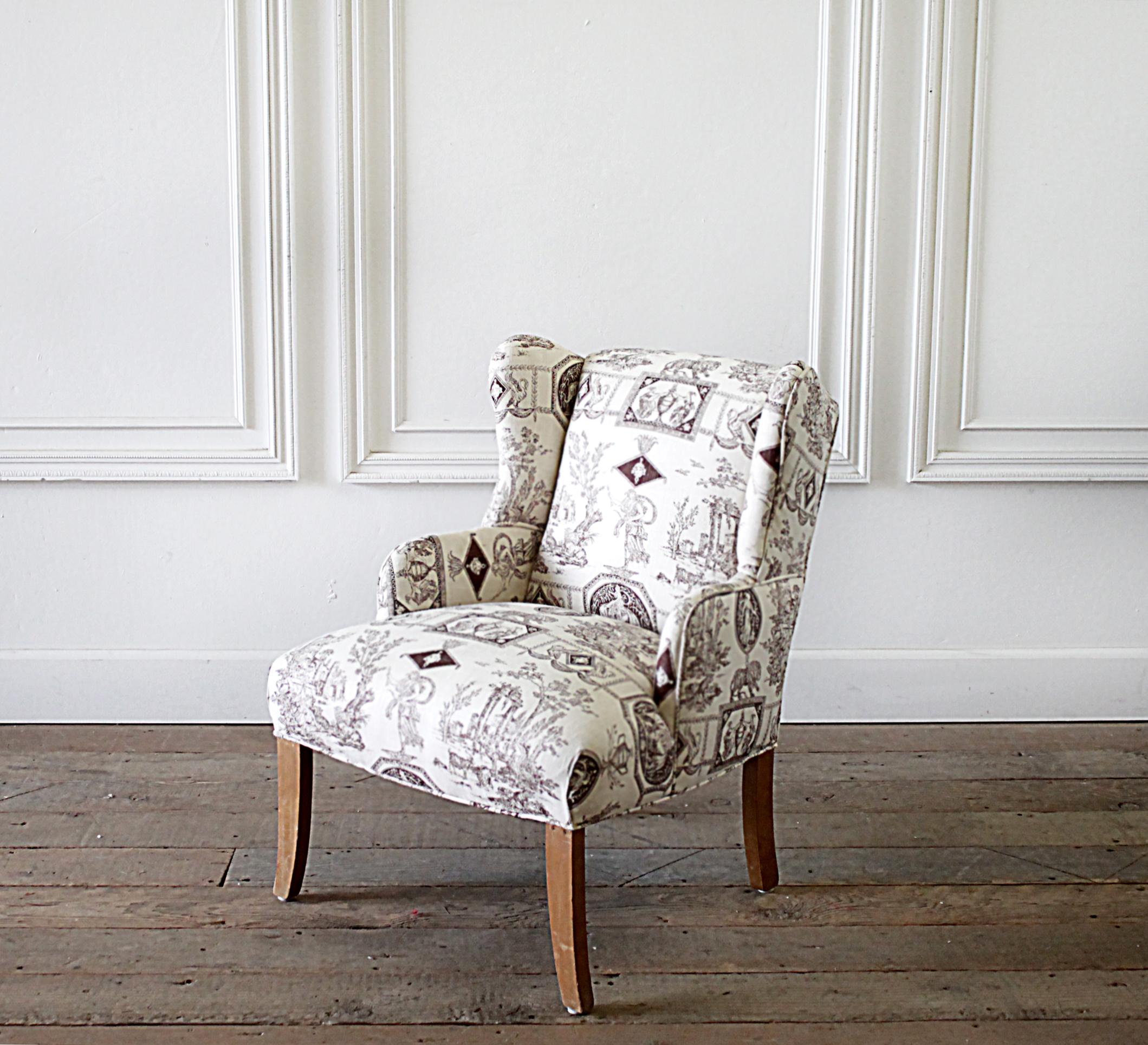 Petite wing chair upholstered in brown Toile fabric.
Could be used for a child’s chair, this is petite. Please review sizes. They have natural wood finished legs.
Dimensions:
21