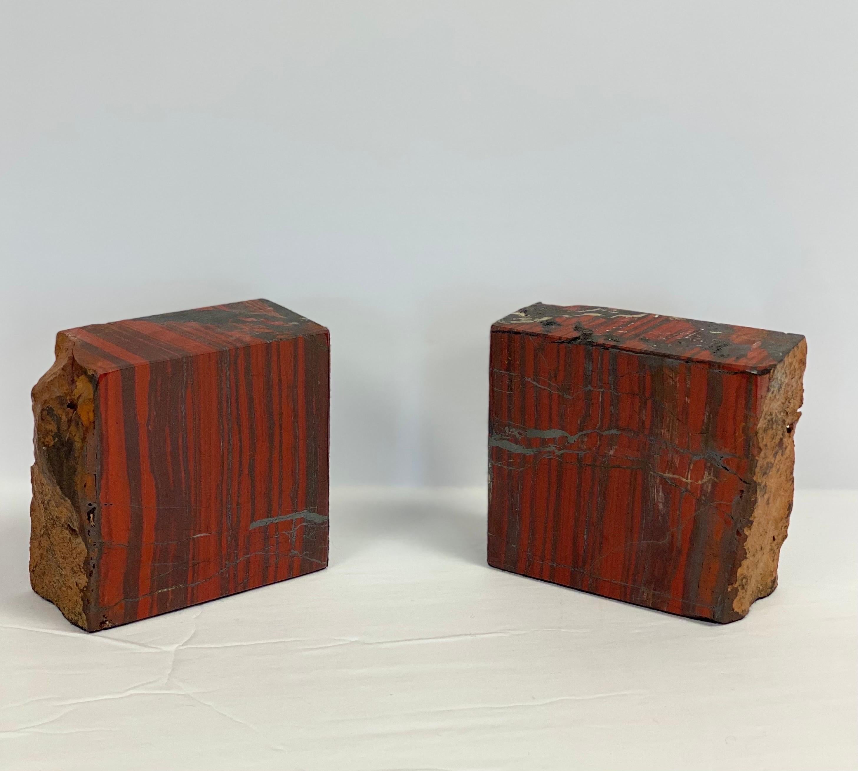 We are very pleased to offer a unique pair of heavy-weight, petrified wood bookends, circa the 1960s. Petrified wood is the name given to wood that has been turned into stone (fossilized) through the process of permineralization. This type of