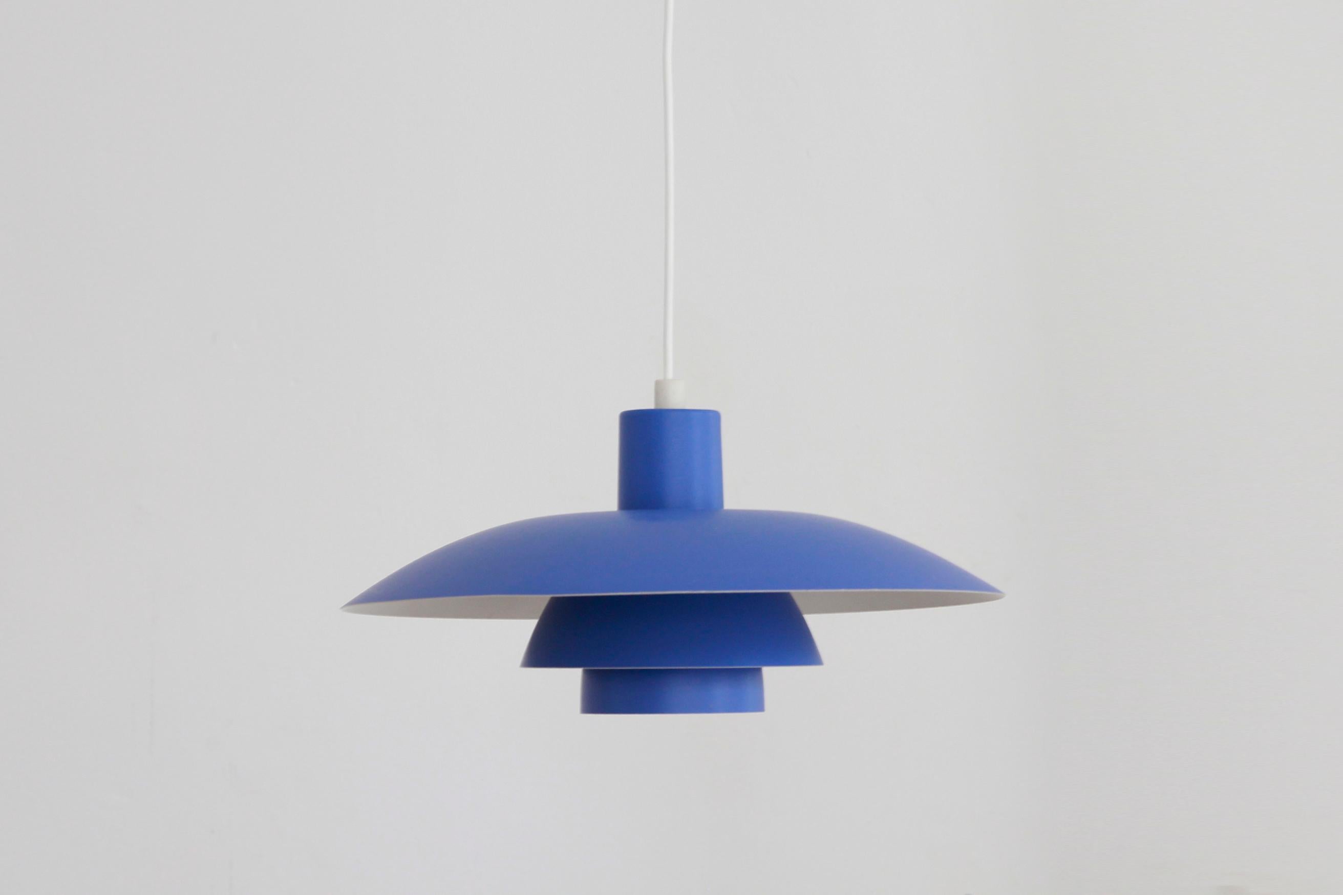 Beautiful vintage design hanging lamp by Poul Henningsen for Louis Poulsen in blue color. This lamp is called the PH 4/3. The lamp is designed in such a way that you have a maximum diffusion of light and minimal glare in your eyes. Measures: The