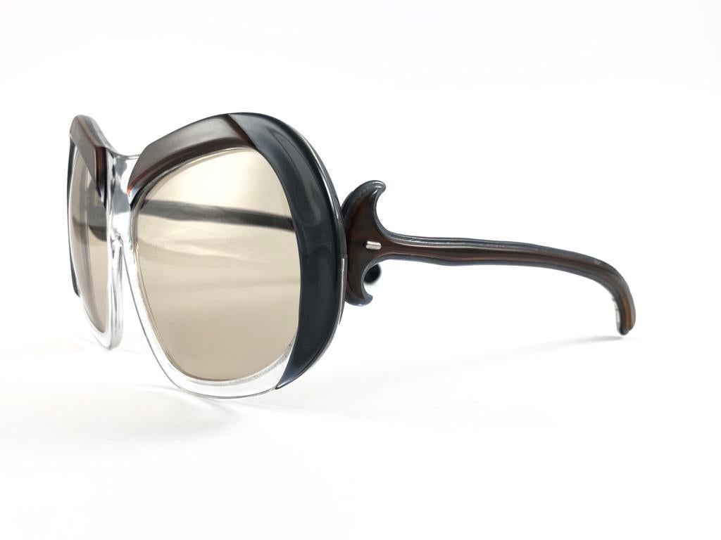 A True Iconic Philippe Chevallier translucent & solid brown and grey Frame Sporting A Beautiful Pair Of Medium Brown Lenses. 
This Pair May Show Slight Wear On Them Due To To Nearly 50 Years Of Storage  Please Study The Pictures Before