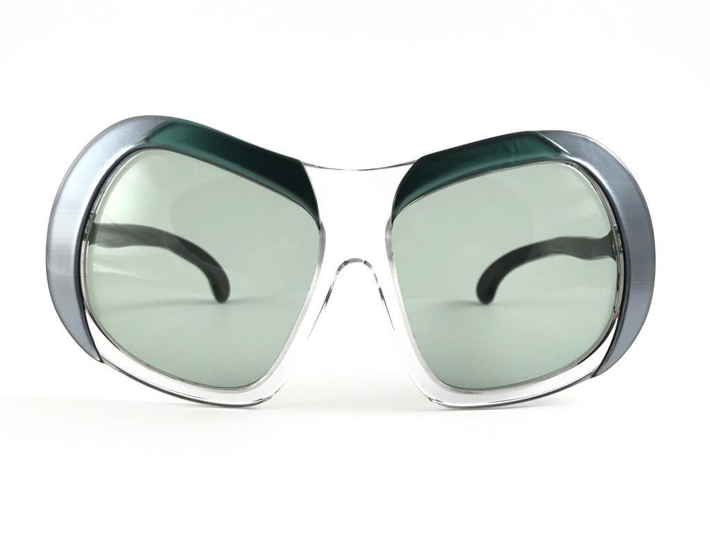 A True Iconic Philippe Chevallier translucent & turquoise Frame Sporting A Beautiful Pair Of Medium green Lenses. 
This Pair May Show Slight Wear On Them Due To To Nearly 50 Years Of Storage  Please Study The Pictures Before Buying.


This Pair Of