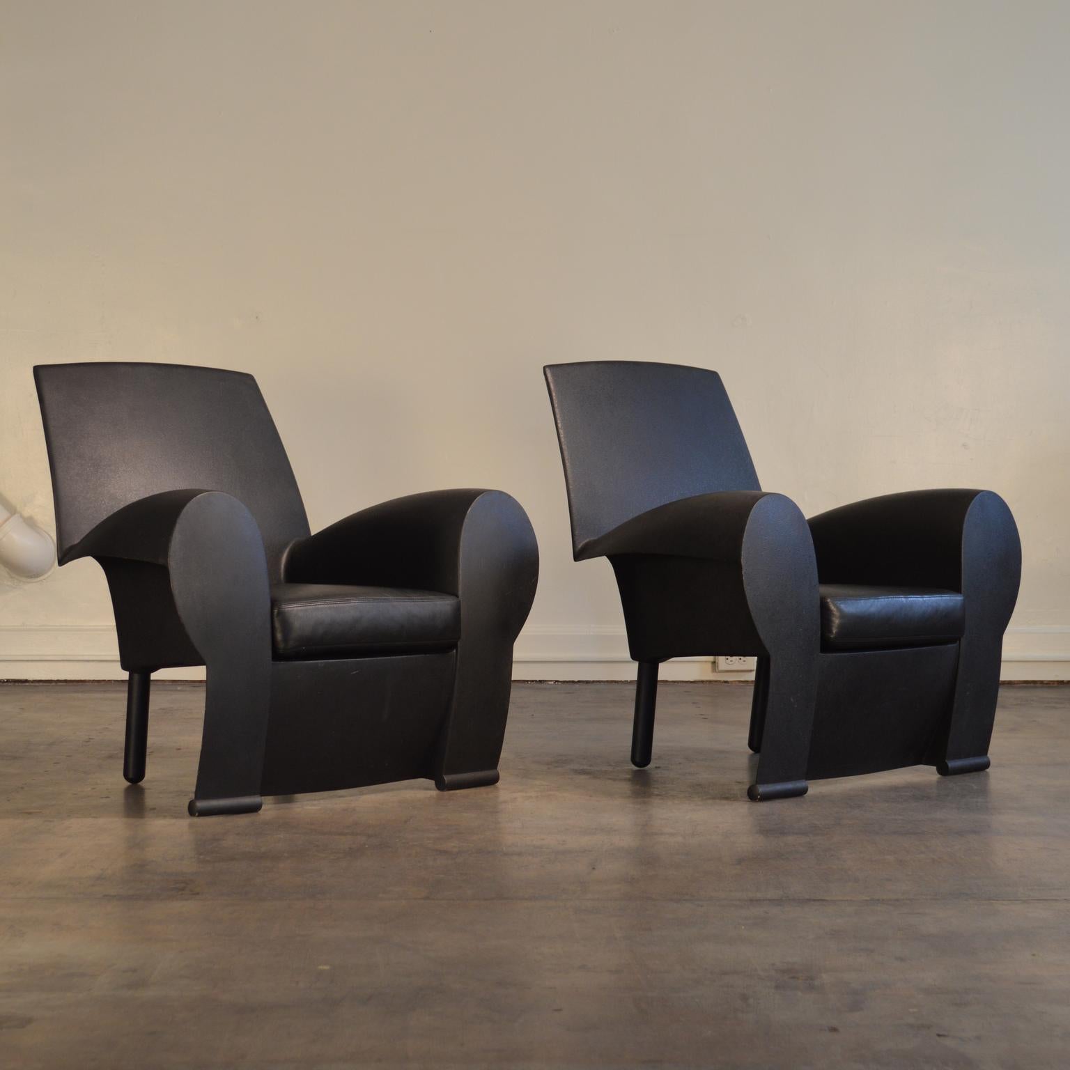 A vintage pair of Richard III chairs by Philippe Starck. Moulded frames covered in polyurethane enamel. An early Starck design, it demonstrates his knack for both utilizing and up-ending traditional forms. From the front, the Richard III presents as
