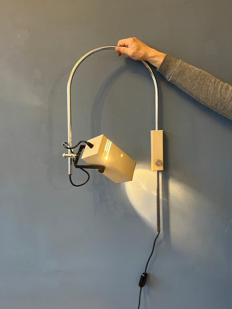 Very rare vintage arc wall lamp by Philips. The spot can be placed inside or outside arc and positioned in any direction desirable. The lamp has a switch build into the cable. The lamp requires an E27/26 (standard) lightbulb and currently has an