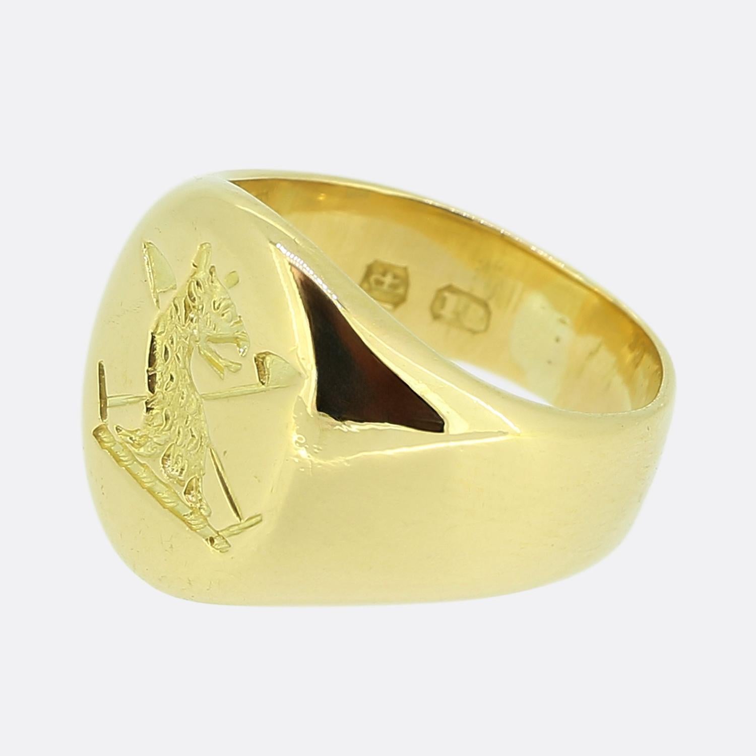 Here we have a fabulous intaglio signet ring. The face features an intricately engraved depiction of the myological bird of a phoenix, poised with a regal stance. Behind it, two crossed elements add a touch of symmetry and balance. Crafted in 18ct