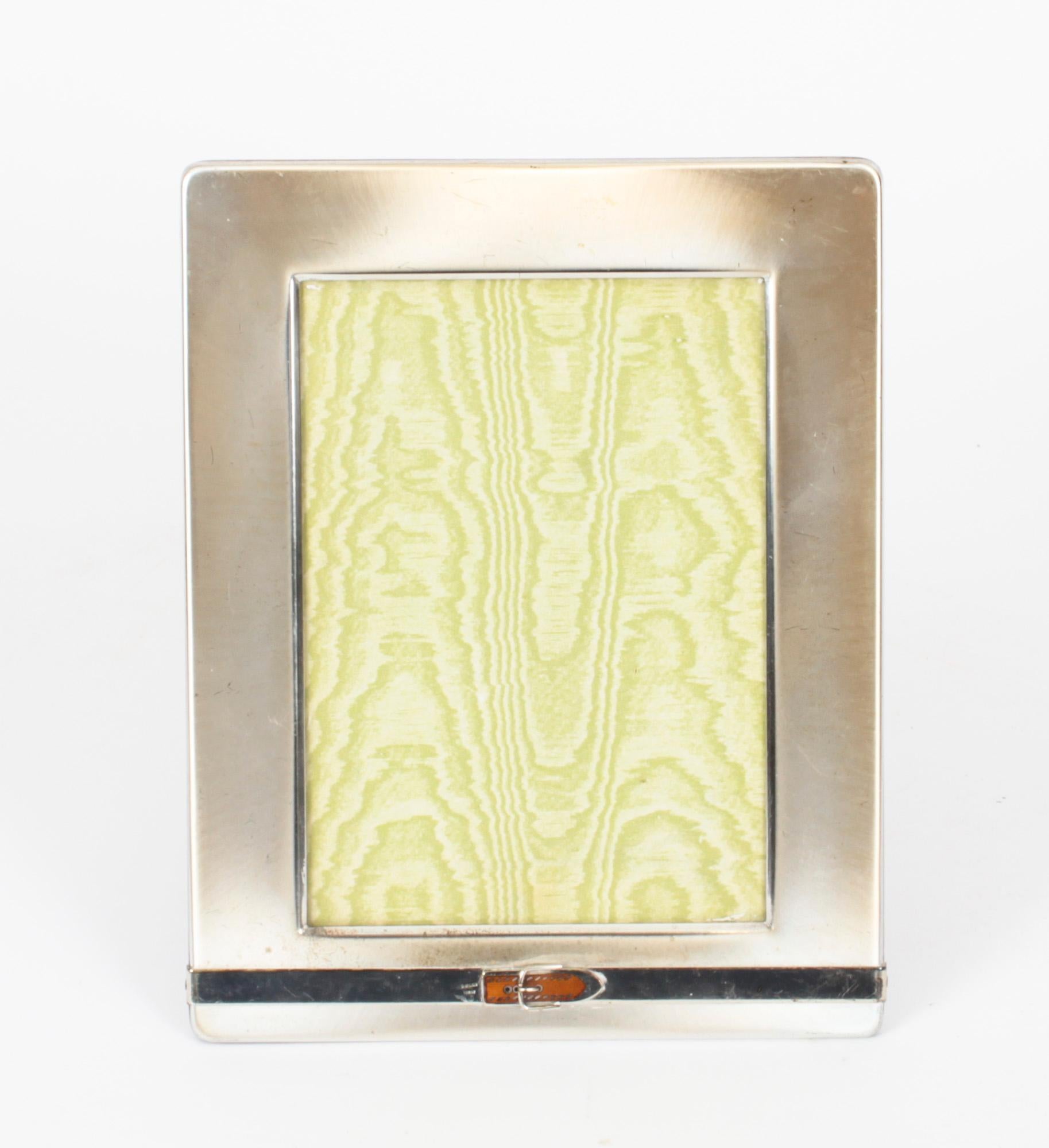 A truly superb decorative photo frame by Gucci, Late 20th century in date.

The frame features a decorative belt design to the bottom with silvered metal borders.

It takes a 7x5 inch (18x13cm) photo.
 
An excellent gift idea for many