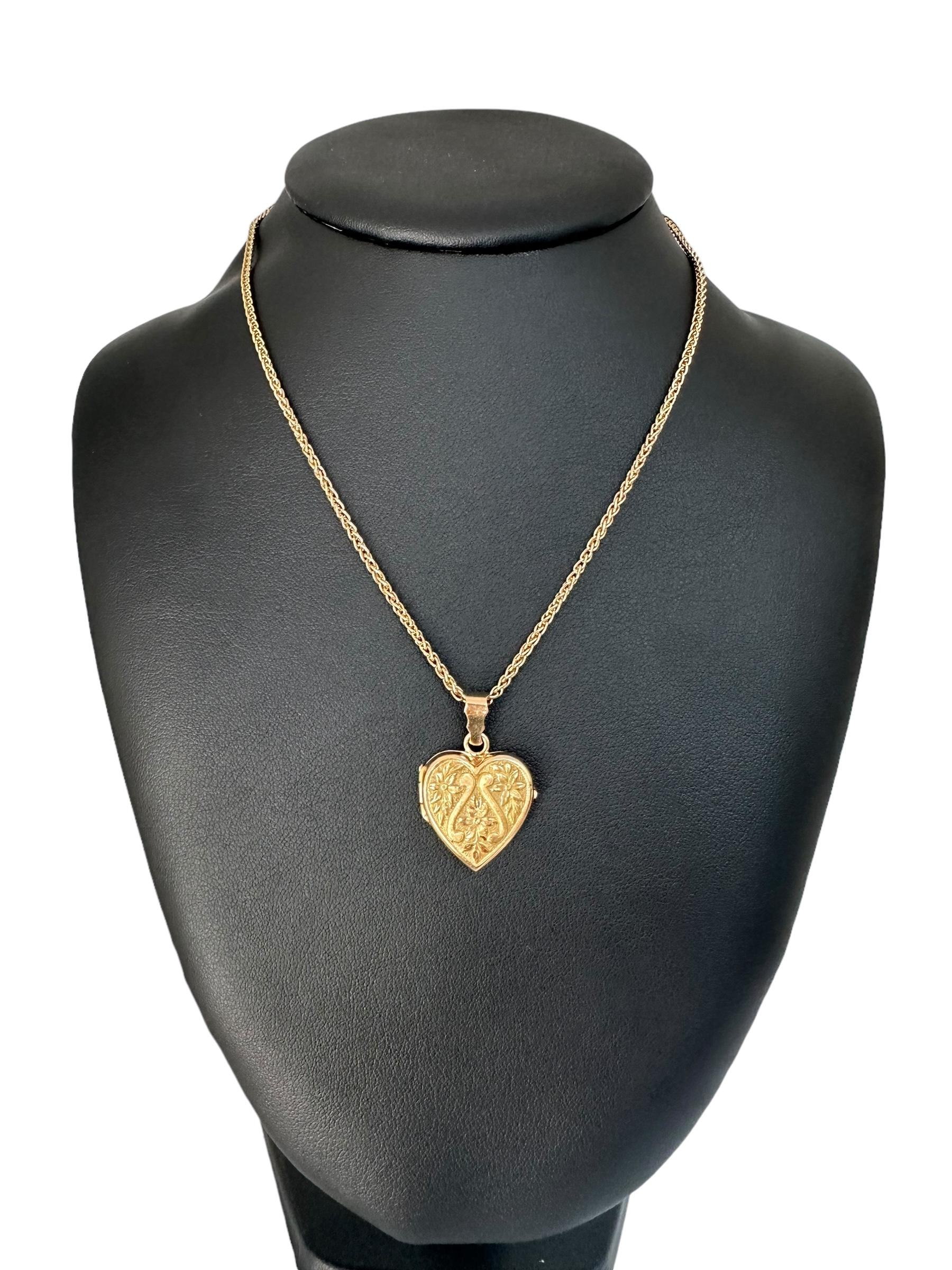 This Vintage Heart Photo Holder Pendant is a charming piece crafted from 18kt yellow gold, radiating warmth and timeless elegance. Shaped in a romantic heart design, it opens to reveal a small compartment perfect for holding a cherished photo or a
