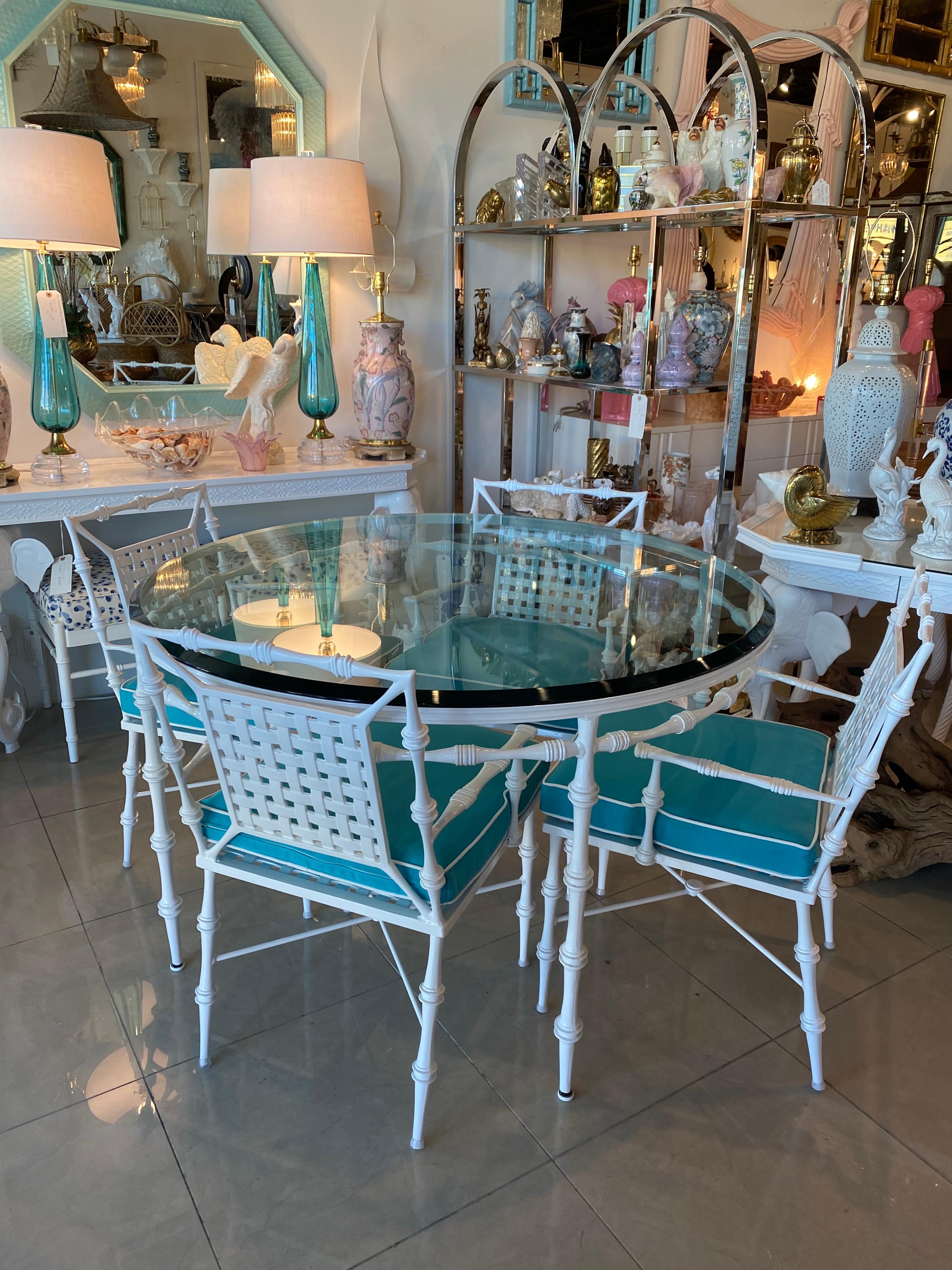 Amazing vintage Phyllis Morris patio outdoor dining set. Set
Includes dining table, glass top, and 4 armchairs with cushions.
This set has been professionally powder-coated in a high gloss white. The custom cushions are removable and are all new