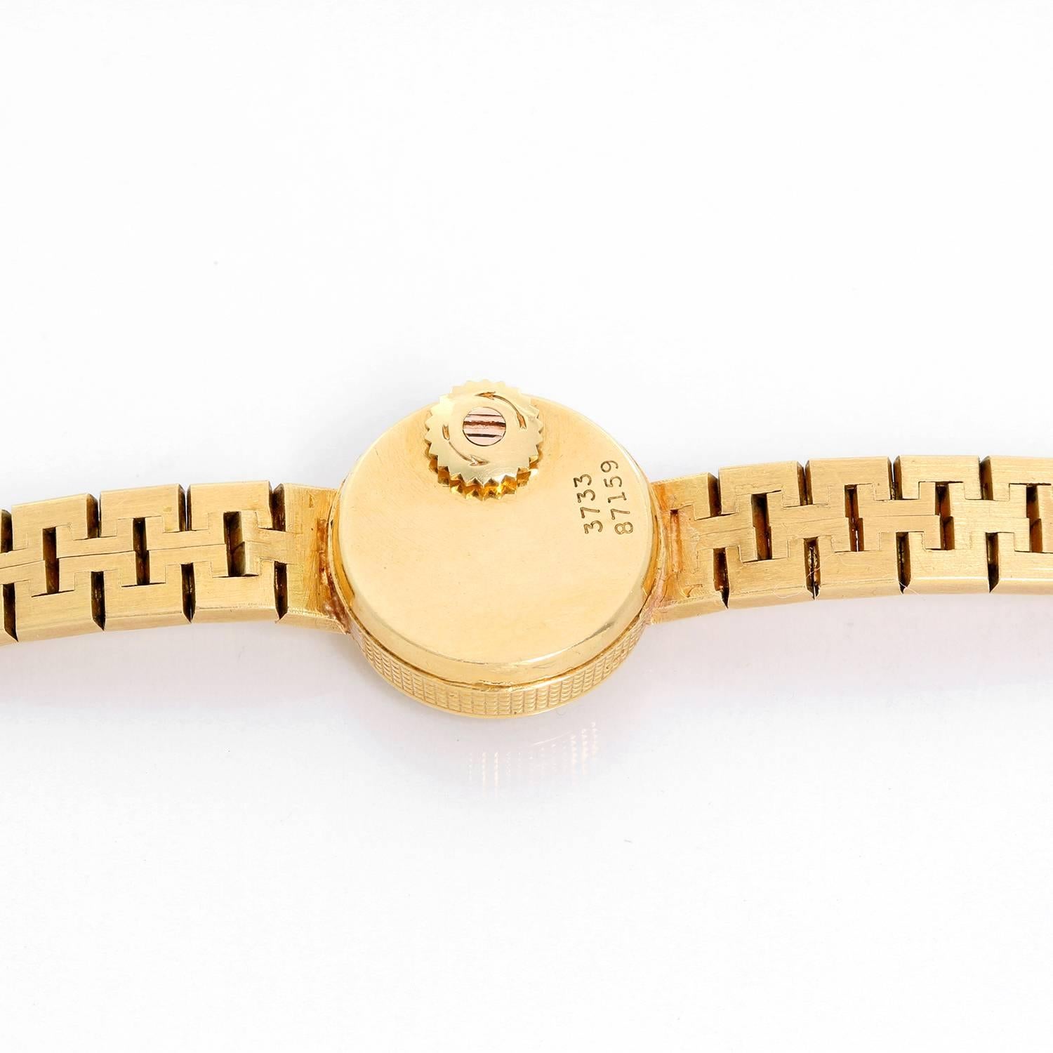 Vintage Piaget 18K Yellow Gold Ladies Watch Ref 3733 -  Manual. 18K Yellow Gold ( 17 mm ). Champagne texture dial with black stick hour markers. 18K yellow gold textured bracelet. Will fit a 5 1/2 in wrist size. Pre-owned with custom box.