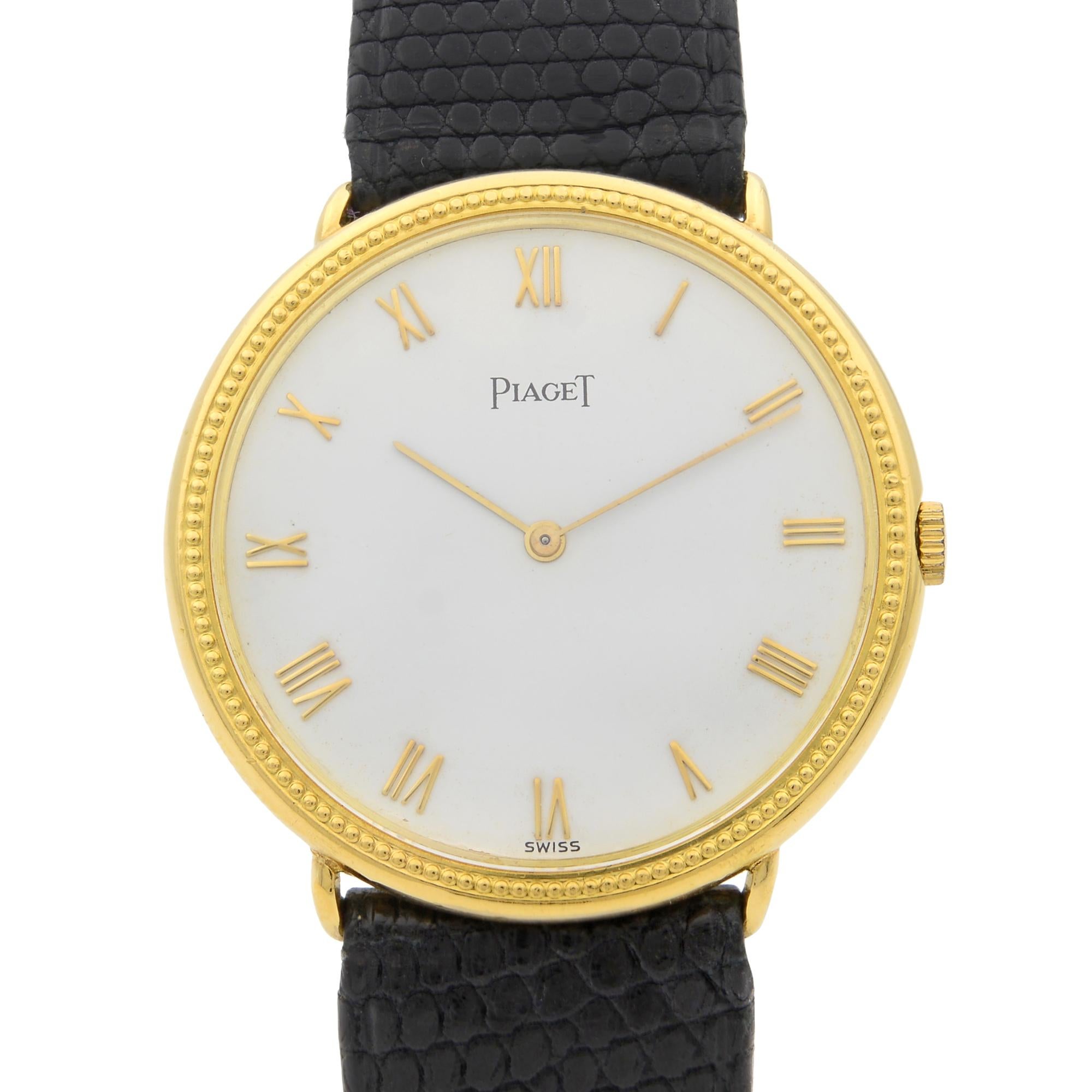 This pre-owned Piaget  90231 is a beautiful men's timepiece that is powered by mechanical (hand-winding) movement which is cased in a yellow gold case. It has a round shape face, no features dial and has hand roman numerals style markers. It is