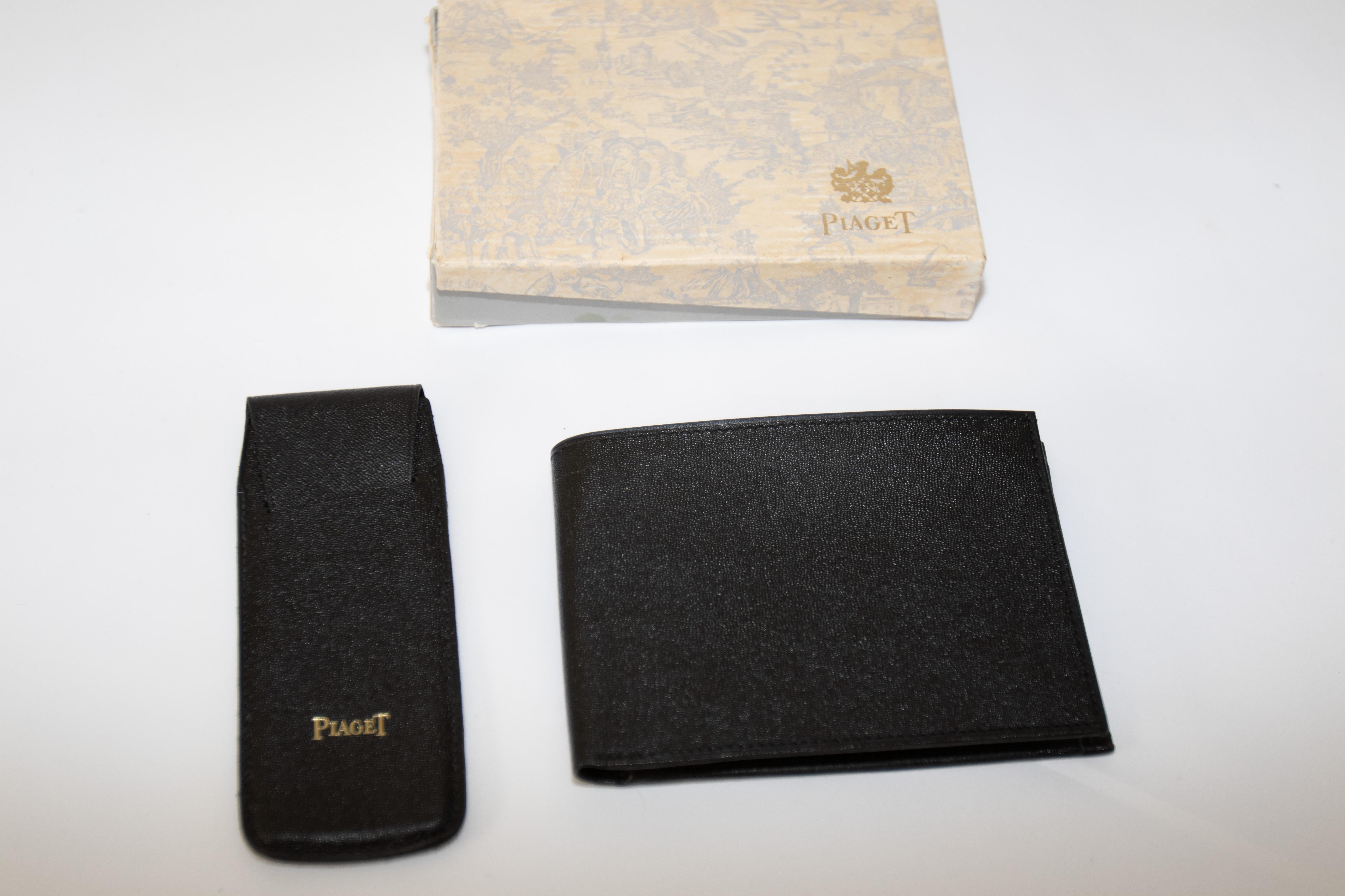 Vintage Piaget black leather wallet and small watch pouch in original vintage box.
Piaget Vintage leather wallet black leather complete outer box new old stock condition.
Wallet has a coin compartment with a snap. Wallet dimensions: 3.5