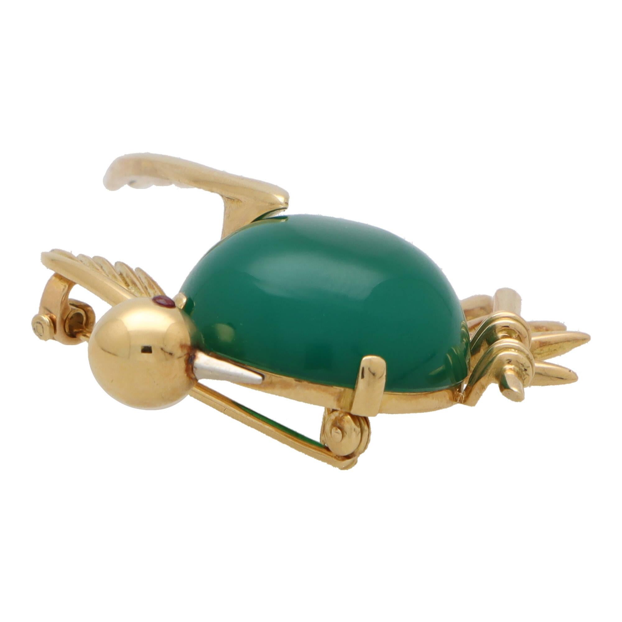 A beautiful vintage Piaget chrysoprase bird brooch set in 18k yellow gold. 

From a discontinued collection, the brooch depicts a bird perching on a branch. The main body of the bird is composed of a large 20mm blue-ish green cabochon chrysoprase
