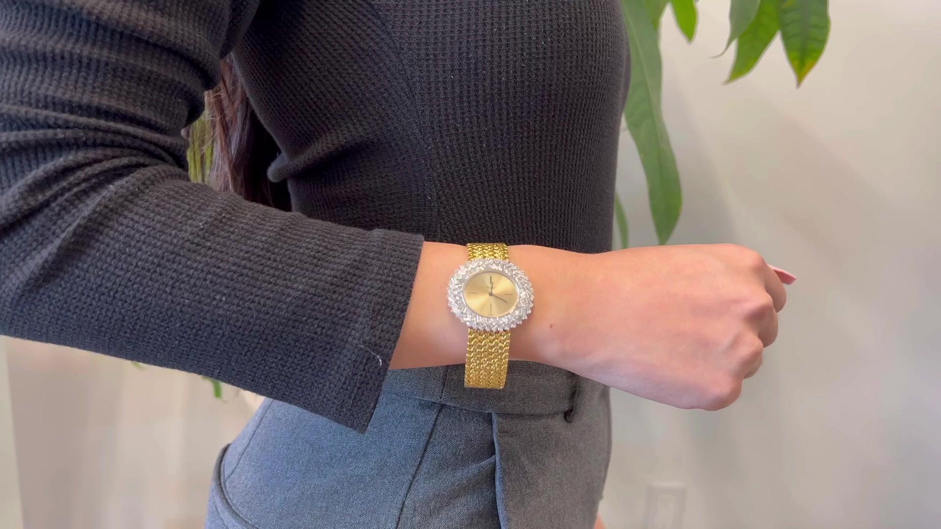 One Vintage Piaget Diamond 18 Karat Yellow Gold Wristwatch. Featuring 72 tapered baguette cut diamonds with a total weight of approximately 4.50 carats, graded F color, VS clarity. Crafted in 18 karat yellow gold and white gold signed Piaget, serial