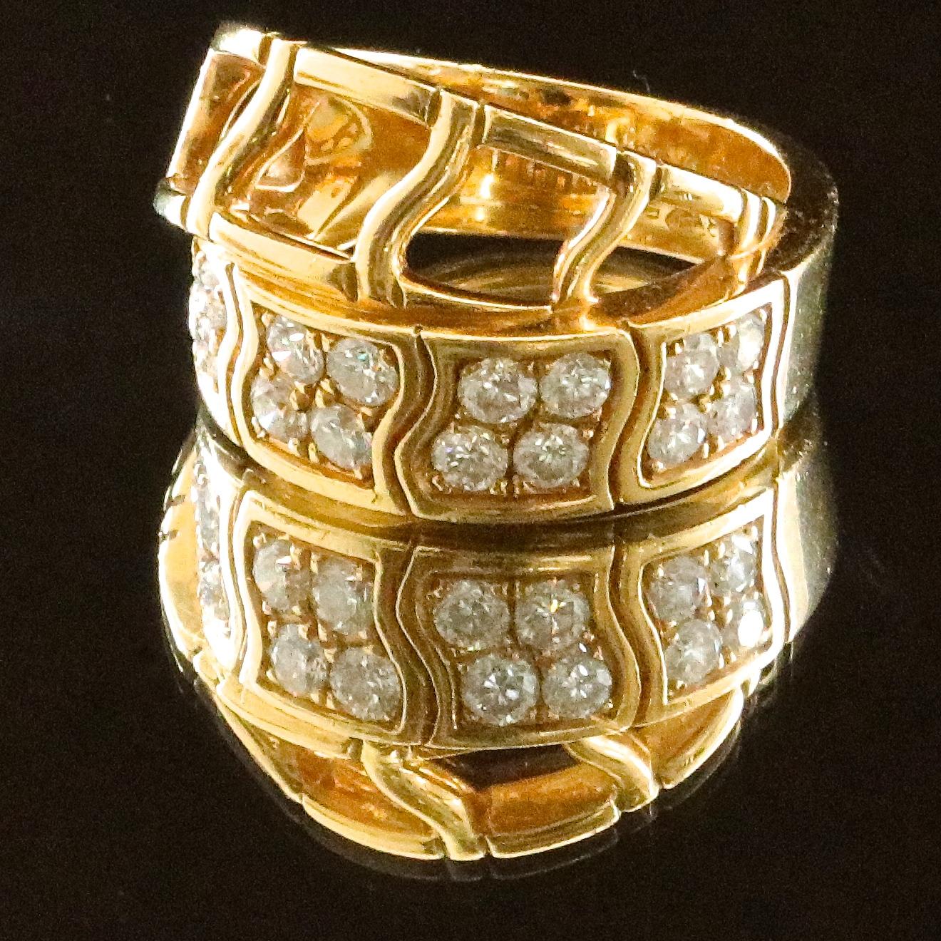 If you like solid gold pieces, accented by diamonds, this vintage diamond 18k gold Piaget ring is the one! Vintage, substantial gold pieces are a hot trend right now and are a must have. The ring features 16 round brilliant cut diamonds