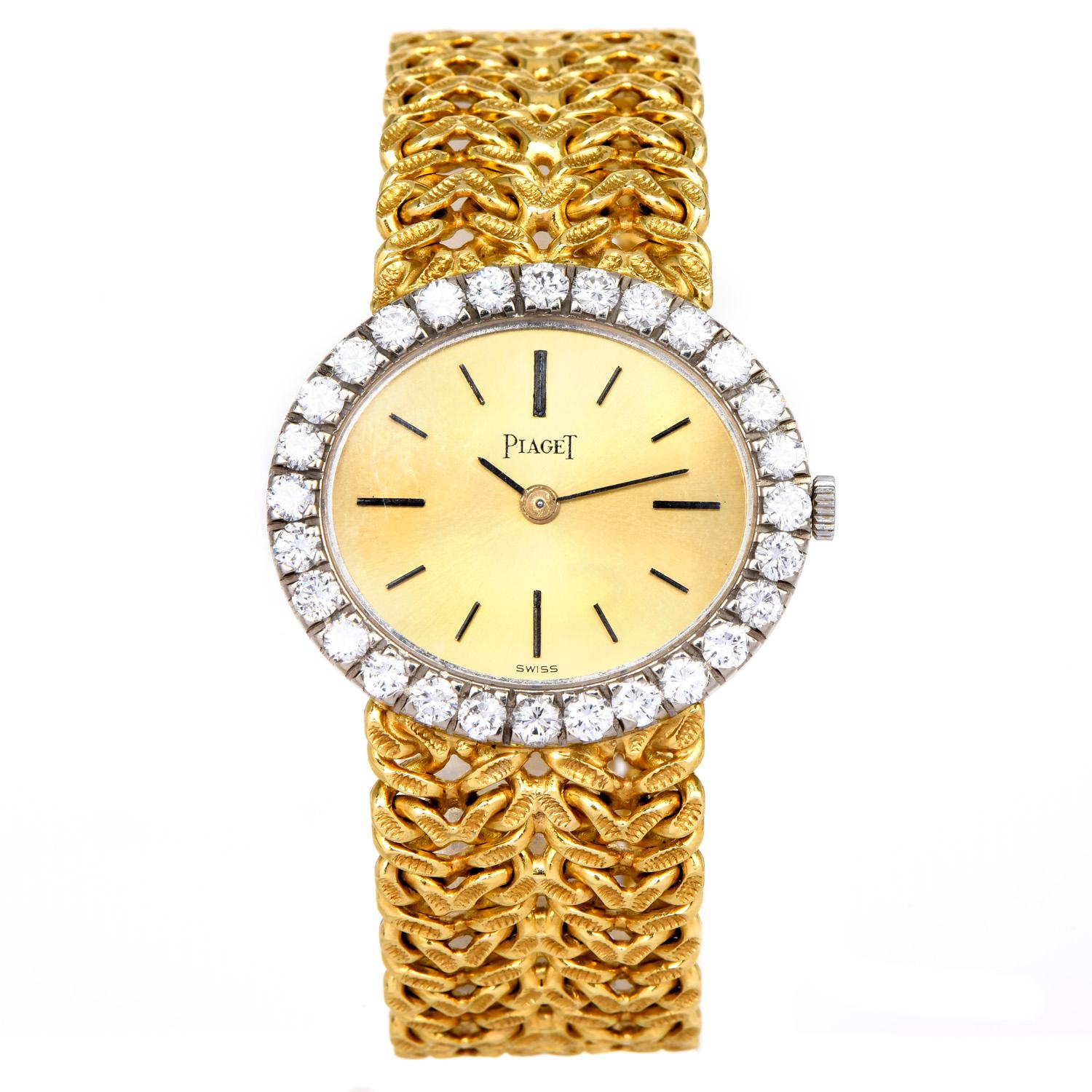 Exquisite & intricate design form the house of Piaget.

This vintage 18K yellow gold watch has a classic halo oval-shaped diamond bezel. 

surrounded by 28 round-cut factory set diamonds,  prong-set, weighing approx. 1.65 carats, G-H color &