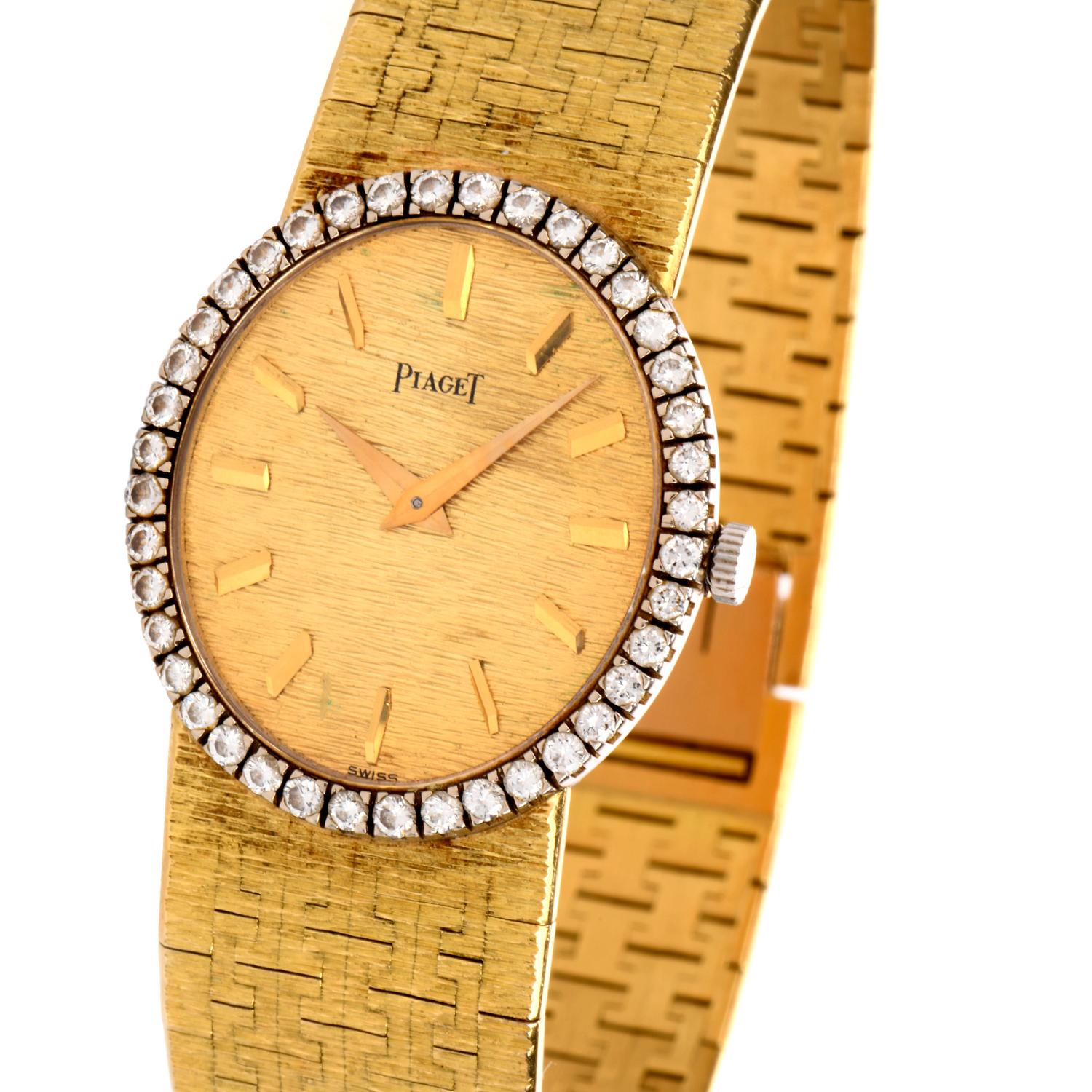 Vintage early 1980's Piaget watch crafted 18-karat yellow gold, embellished with a diamond crown.

 Dimensions: 25mm
Dial: Gold
Weight: 61 grams
Watch Movement: Mechanical Winding
Bracelet Strap: 18K Yellow Gold (measures 7 “)
Buckle: Folding
High