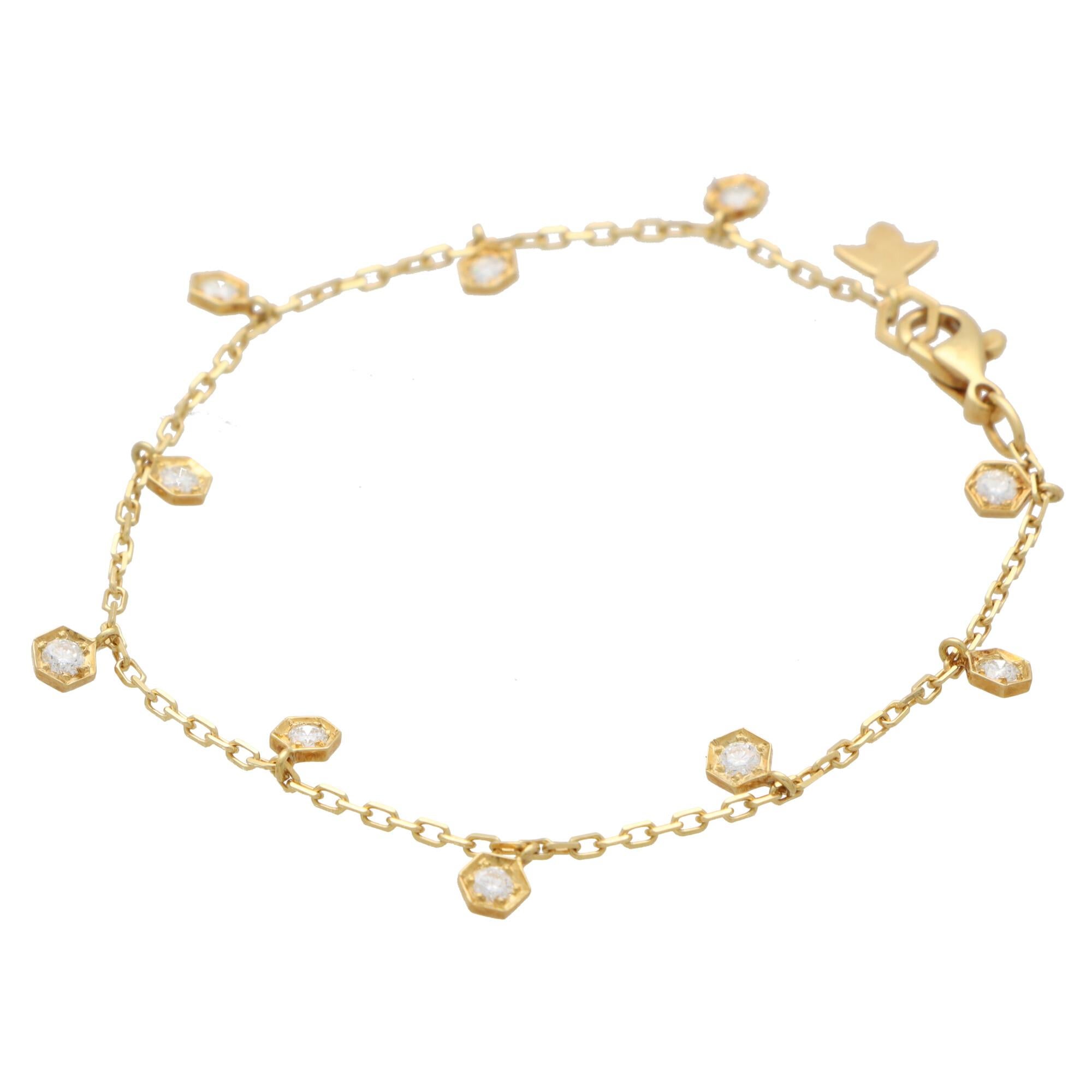  A stylish vintage Piaget Honeycomb Bee diamond chain bracelet set in 18k yellow gold.

The bracelet is composed of a fine yellow gold trace chain from which 10 honeycomb charms dangle from. Set centrally to each honeycomb is a round brilliant cut
